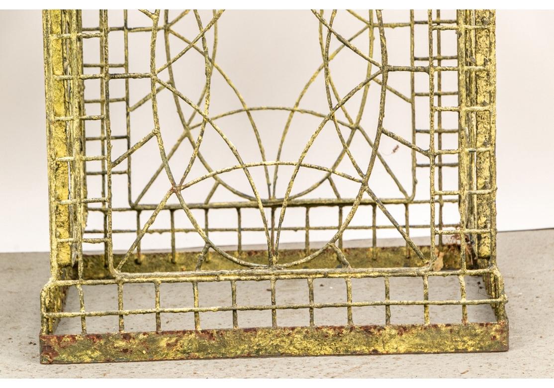 Pair of Older Painted Wire Garden Urns on Pedestals In Distressed Condition In Bridgeport, CT