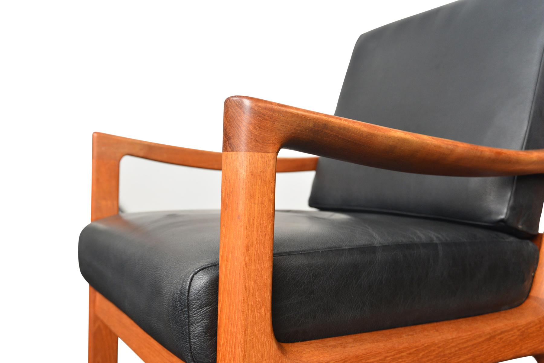 The timeless style of the Senator chairs by Ole Wanscher will add the warmth of vintage to any modern home. The chairs feature an exquisite blend of solid teak and sumptuous black leather. Enjoy the quality that only 65+ years of craftsmanship can