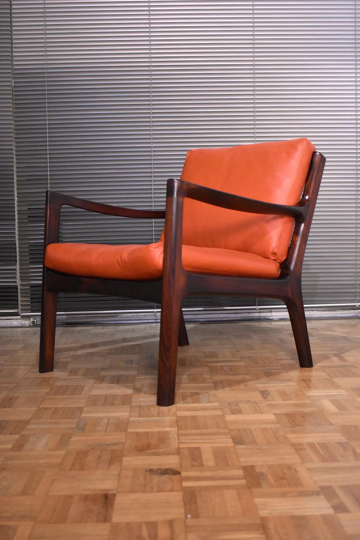 An excellent pair of senator chairs designed by Ole Wanscher for France & Son, Denmark.

Produced with solid Brazilian rosewood this design looks absolutely stunning executed in this timber. Only a relatively small amount of chairs were produced