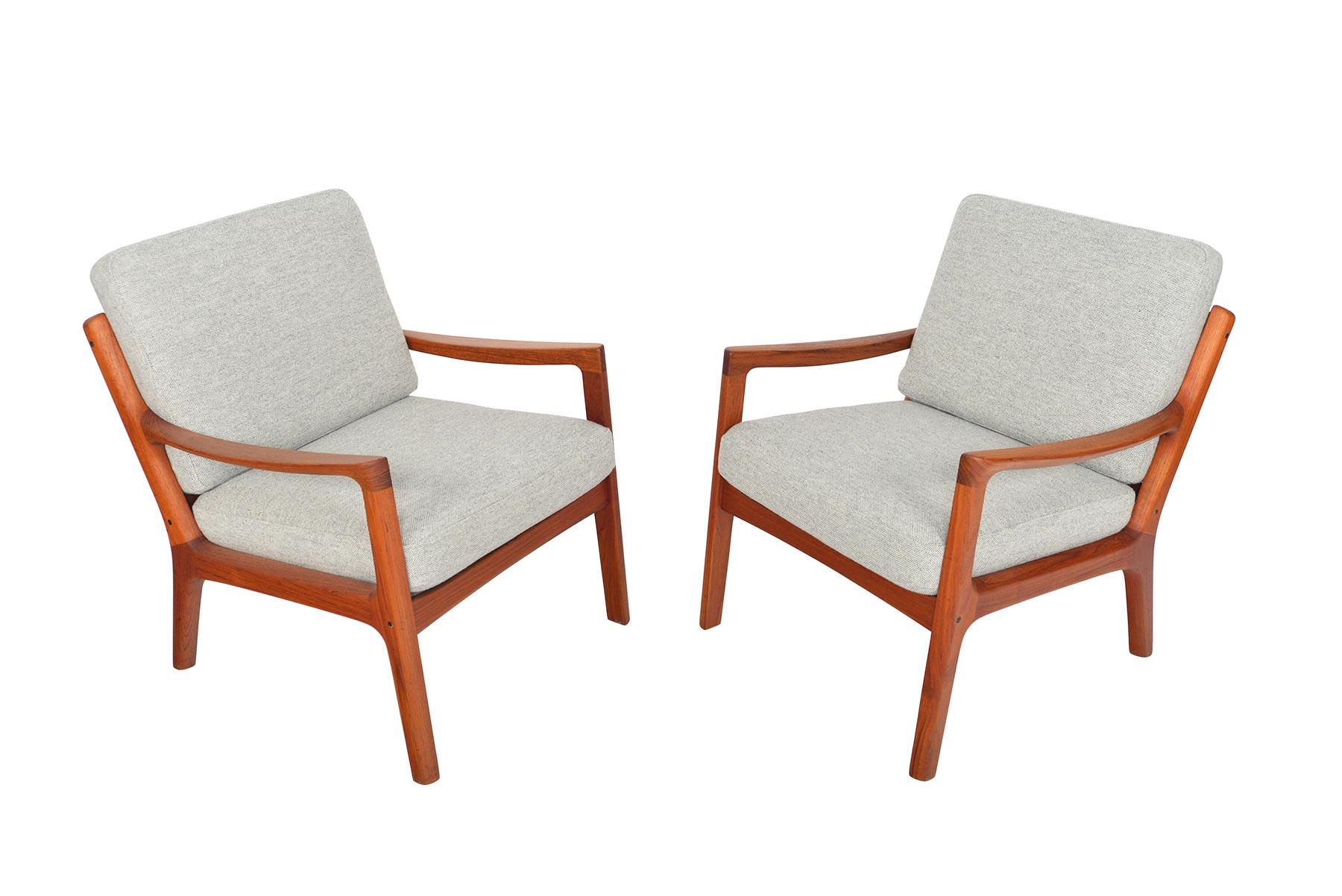 This pair of Senator model 166 teak lounge chairs was designed by Ole Wanscher for France and Son in the 1960s. Crafted in solid teak with understated elegant lines, this pair is extremely comfortable and will be a great addition to any modern