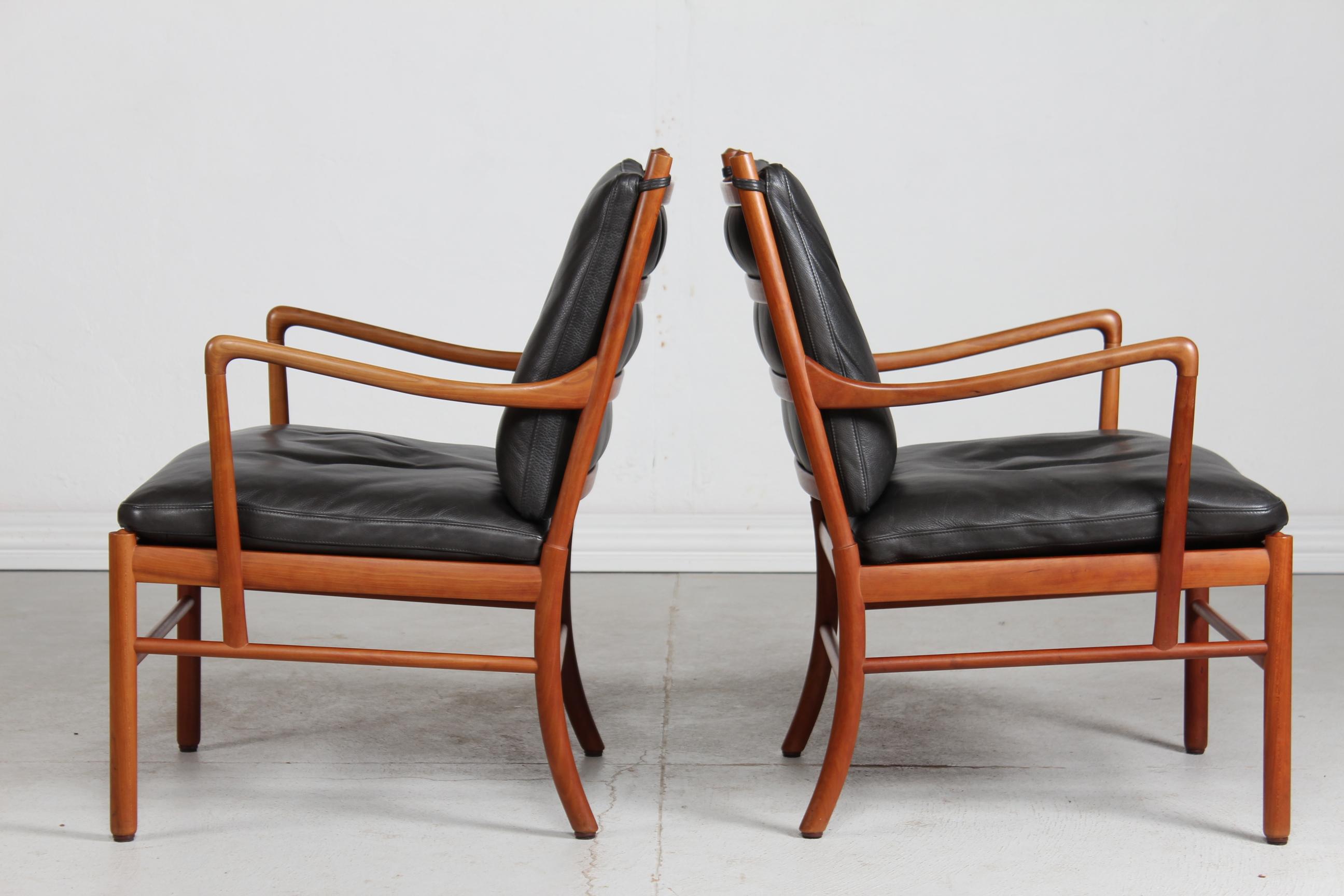 A pair of Colonial chairs model no. PJ 149 designed by Ole Wanscher (1903-1985) in 1949
These chairs are made of cherry wood with original cushions with black aniline leather. 
Manufactured by PJ Møbler, Denmark in the 1990´s

Very nice vintage