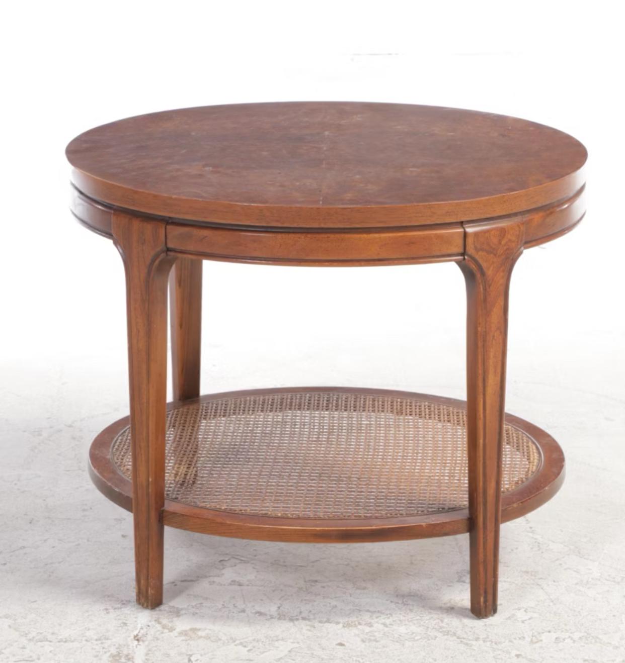 Pair of oval olive ash burl and figured ash end tables with caned bottom shelf. Very distinctive olive ash burl tops to these mid century side tables with solid ash frames. Not Dunbar, but very much in the same style as Edward Wormly’s designs for