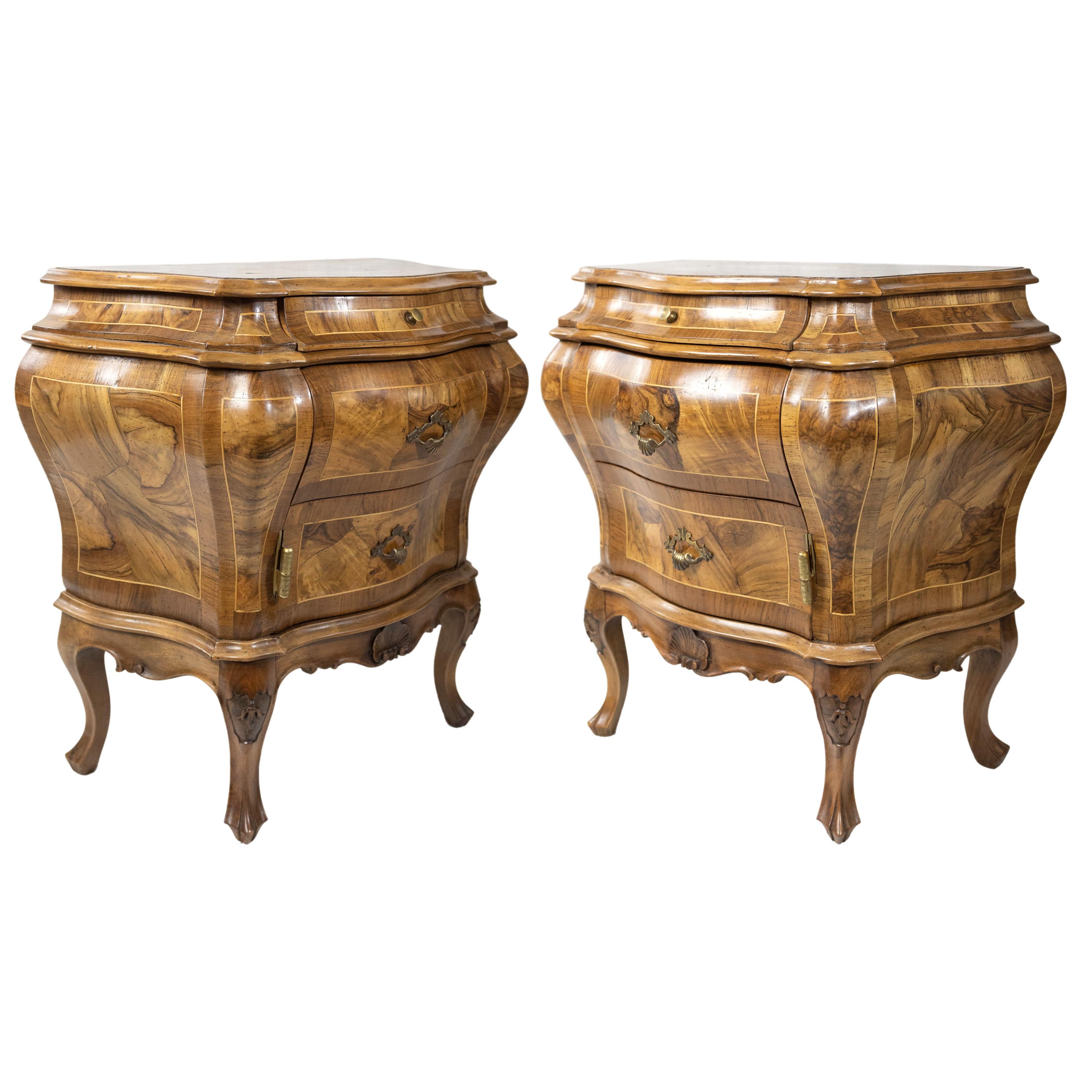 An Exceptional Pair of Olive Wood Bombé Commodes/Side Cabinets, each with a frieze drawer over a single drawer and cabinet, the shaped apron with a carved fan, with further carving to the knees, on stylized cabriole legs. 
Lovely aged patina to the