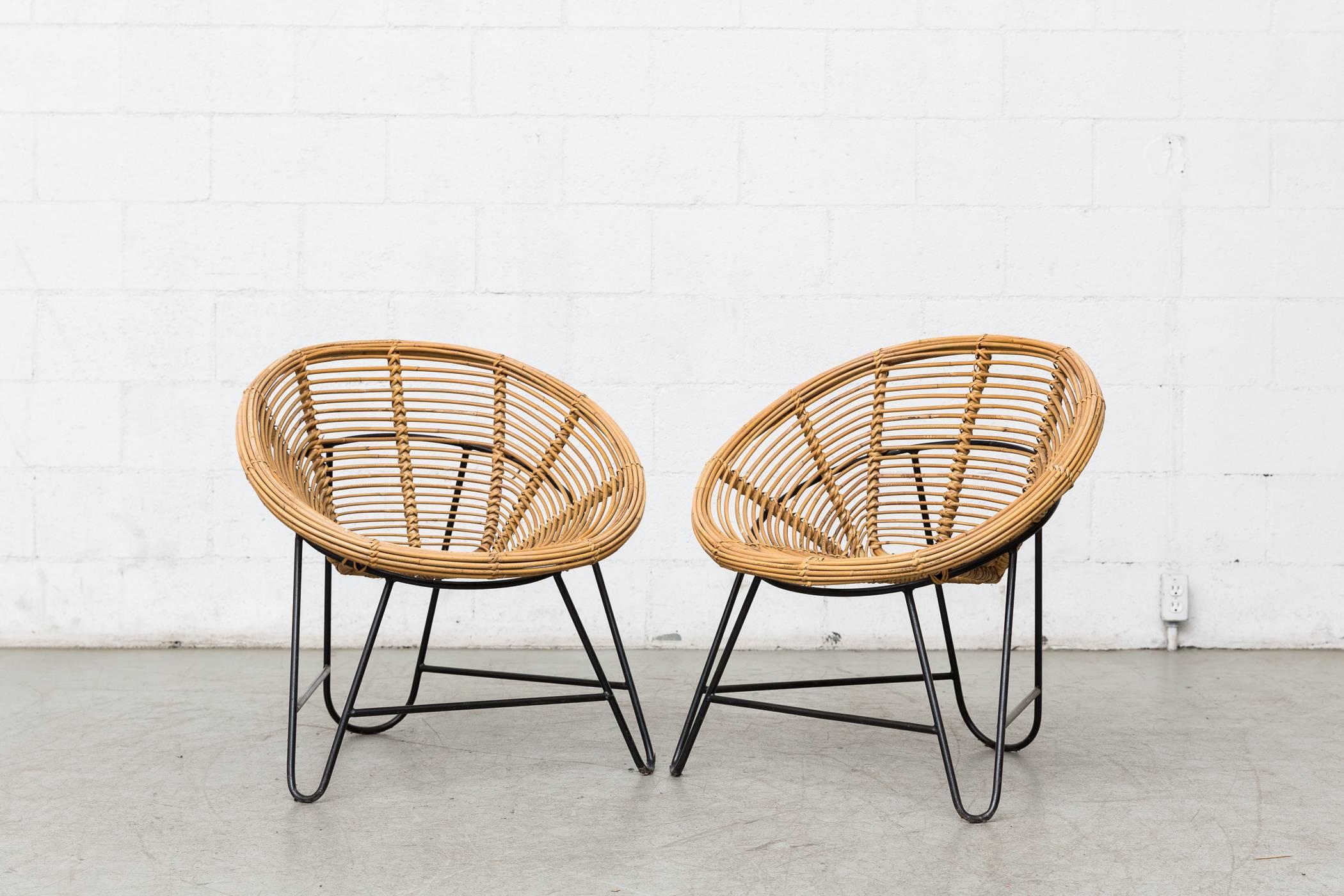 Set of two midcentury bamboo onion skin patterned Hoop chairs with black enameled metal hair pin frames.