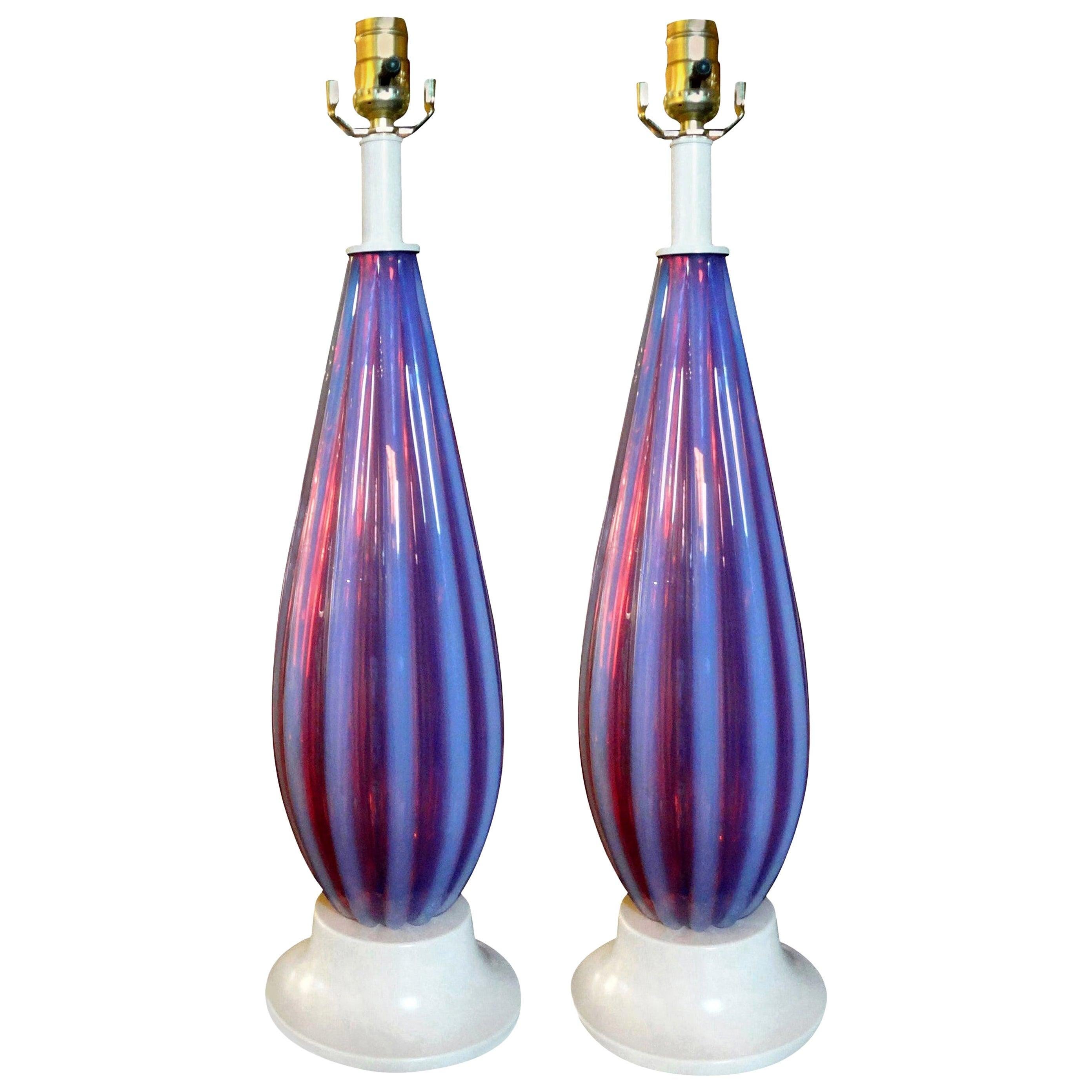 Pair of Opalescent Murano glass lamps attributed to Seguso. Stunning pair of Italian mid-century opaline Murano lamps newly wired for US market. Fabulous color! This pair of Hollywood Regency table lamps are attributed to Seguso.