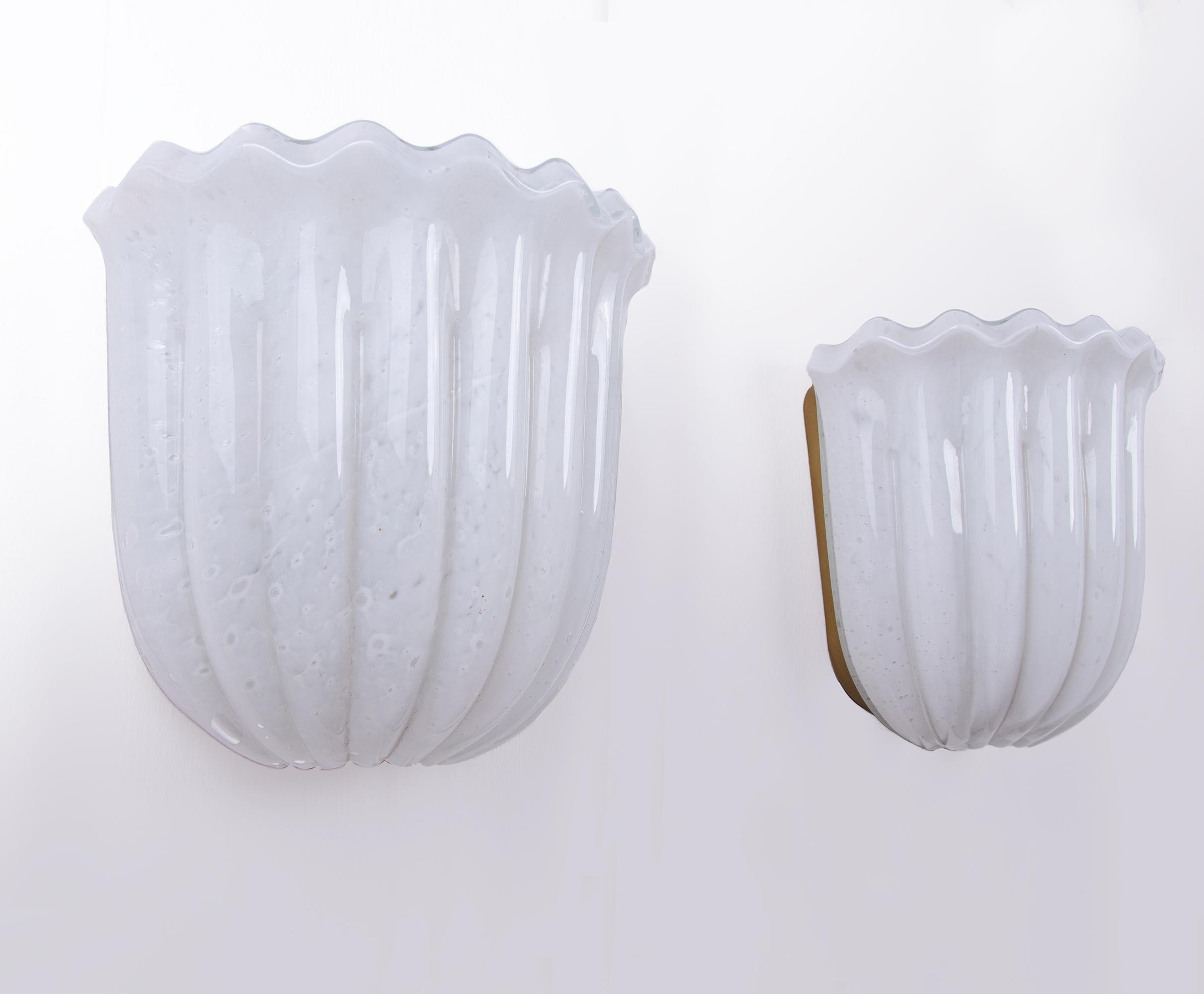 Elegant pair of vintage wall sconces with opaline bubble glass on a metal frame.
Designed and manufactured by Glashütte Limburg in the 1960s in Germany.
Measures: width 8.66