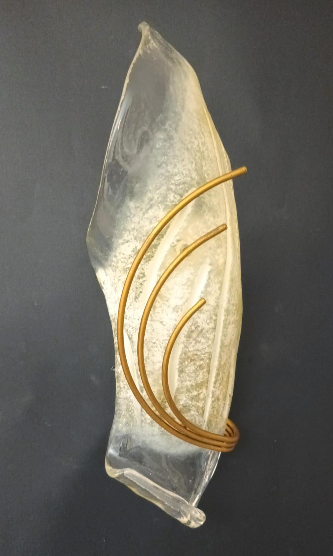 Vintage Italian Art Deco style wall lights with milky opaline Murano glass leaf shades mounted on brass brackets / Made in Italy, circa 1960s
Measures: height 18 inches, width 6 inches, depth 5 inches
1 light / E12 or E14 type / max 40W
1 pair
