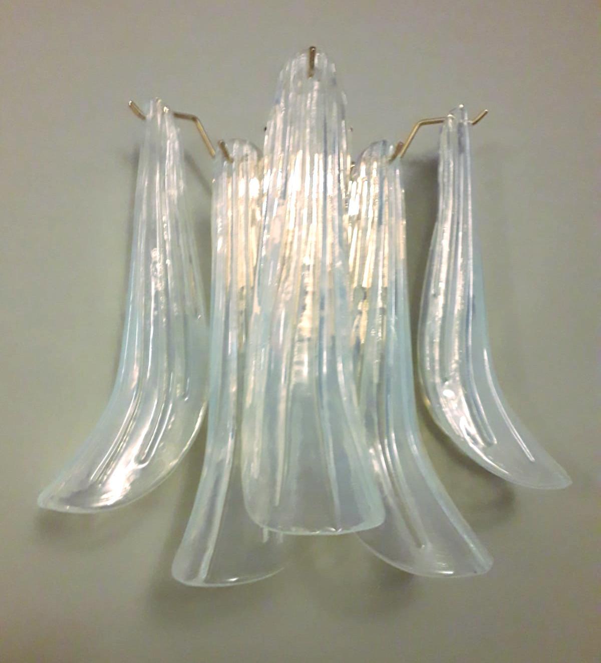 Pair of Italian wall lights with vintage iridescent opaline Murano banana glass petals mounted on newly made gold finish metal frames / Made in Italy
Measures: Height 13 inches, width 14.5 inches, depth 8 inches
2 lights / E12 or E14 type / max
