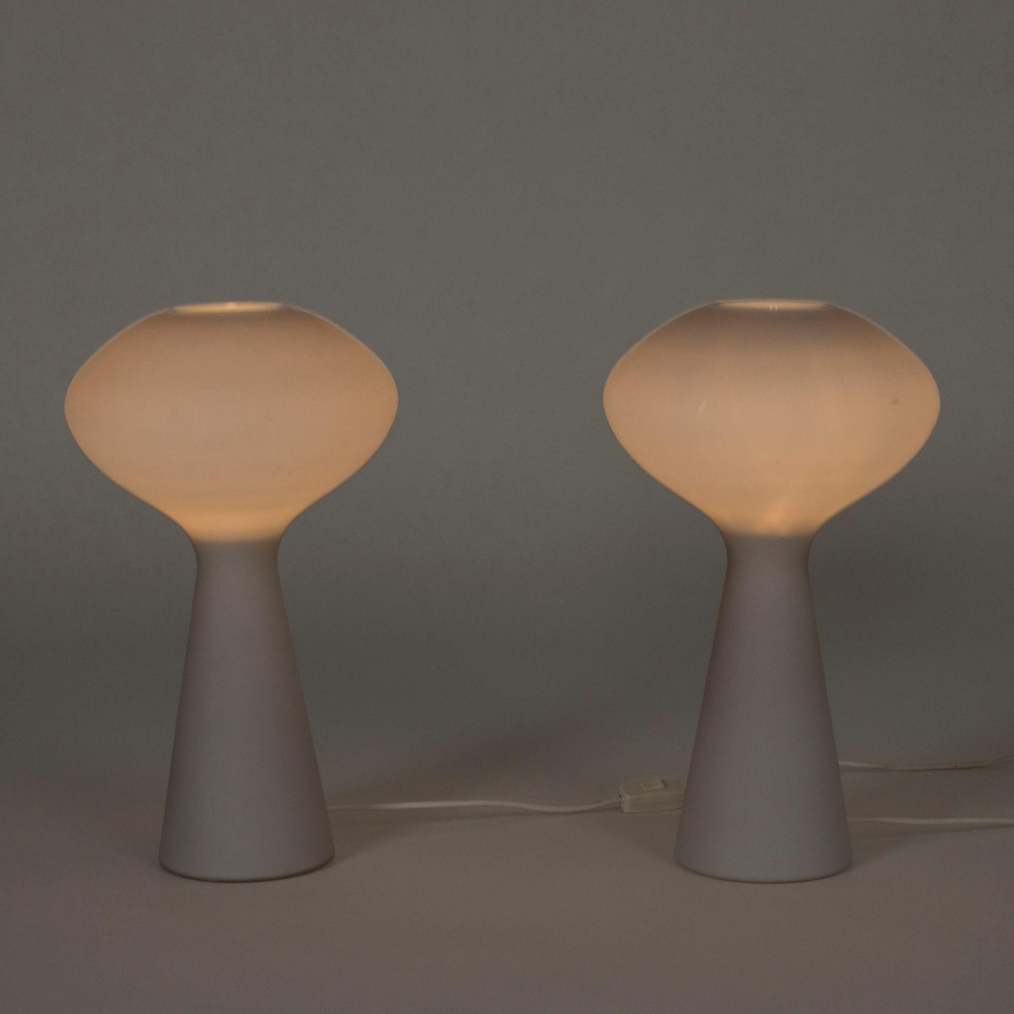 Pair of table lamps by Lisa Johansson-Pape. Made from Opaline glass in a design with underwater and space references. Look amazing, especially when lit.