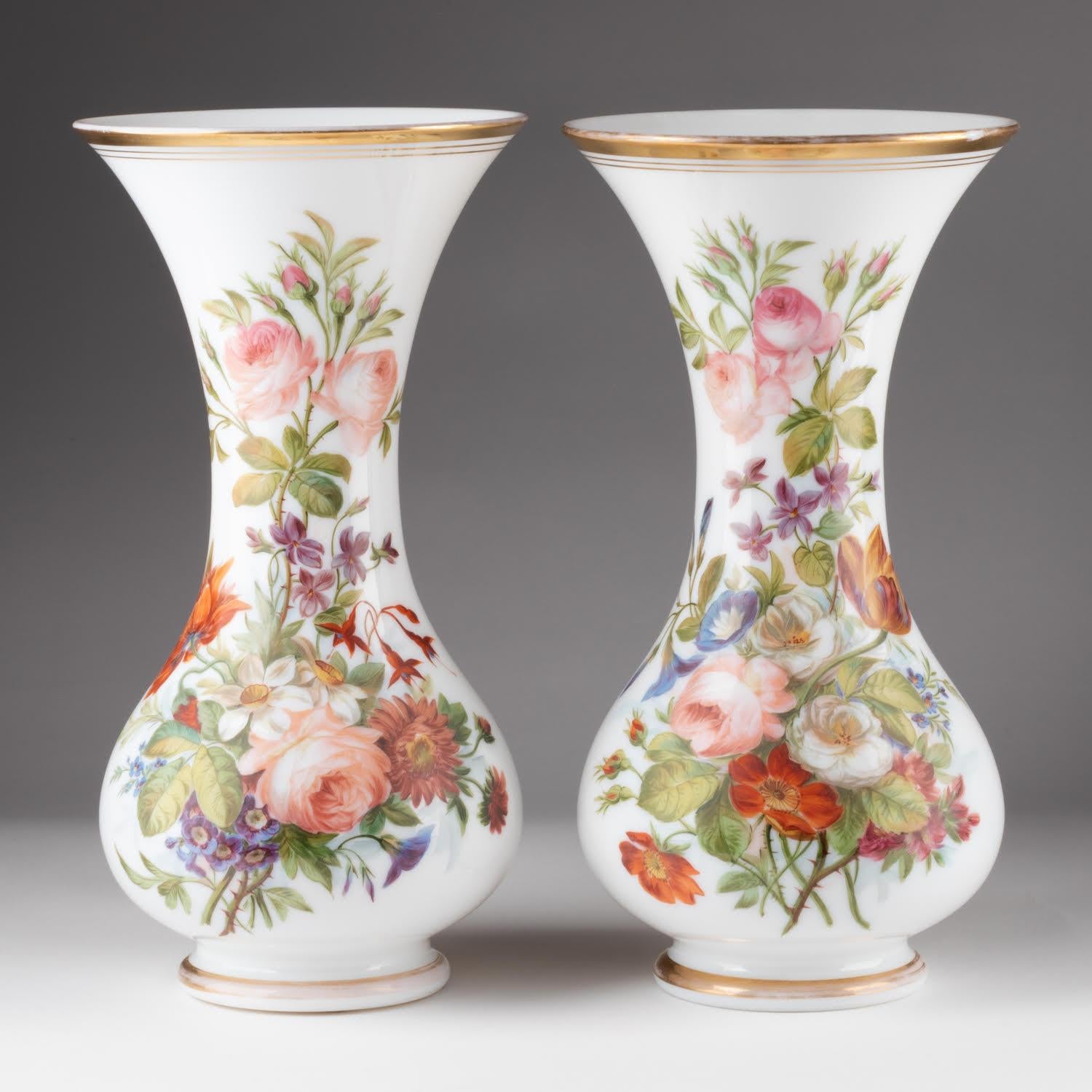 Pair of Opaline Vases Painted with Floral Motifs, 19th Century.

A pair of 19th century opaline vases, Napoleon III period, with a pretty painting of bouquets of coloured flowers, enhanced with gold.   
Photos:(c)inu.studio_art 
H: 34cm , d: 18cm