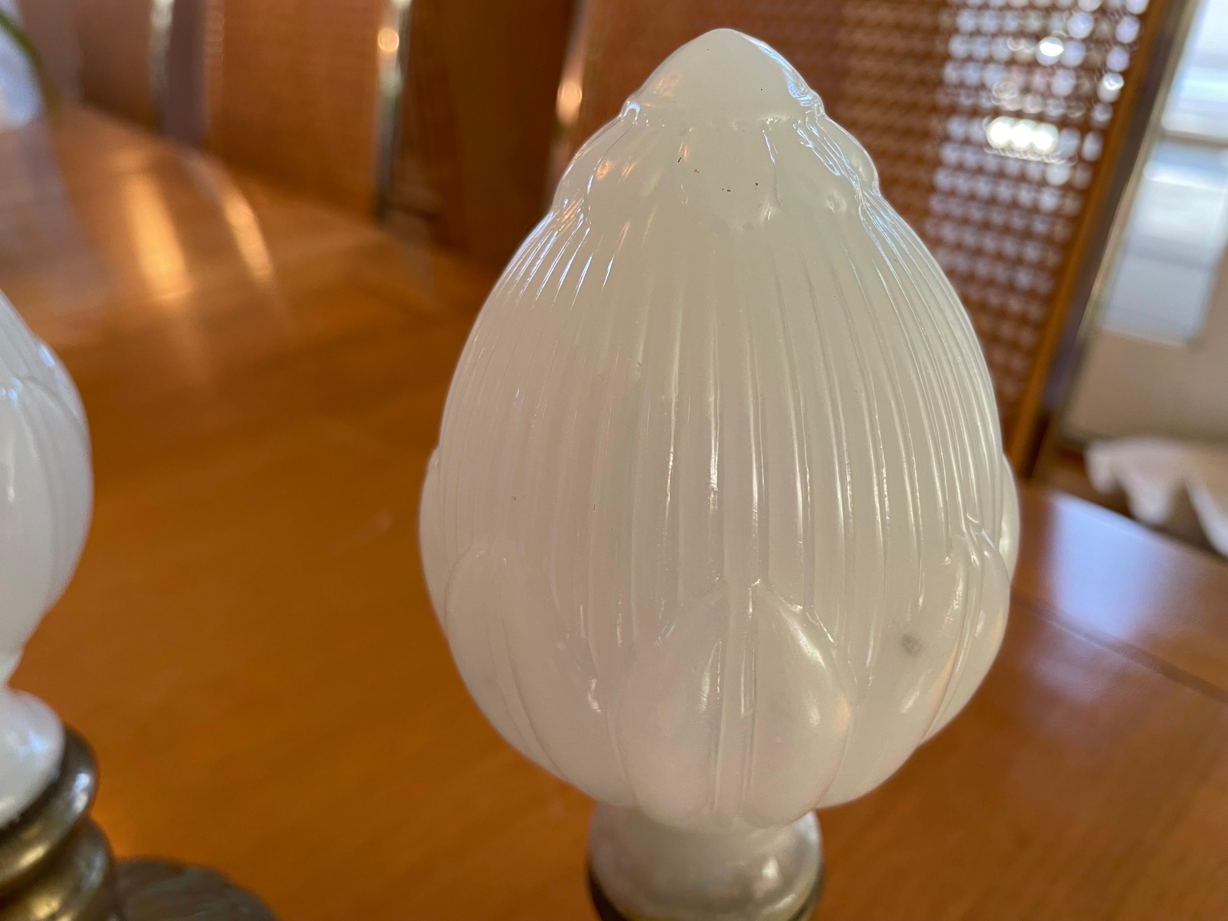 This is a beautiful pair of white opaline glass finials or Newell posts.