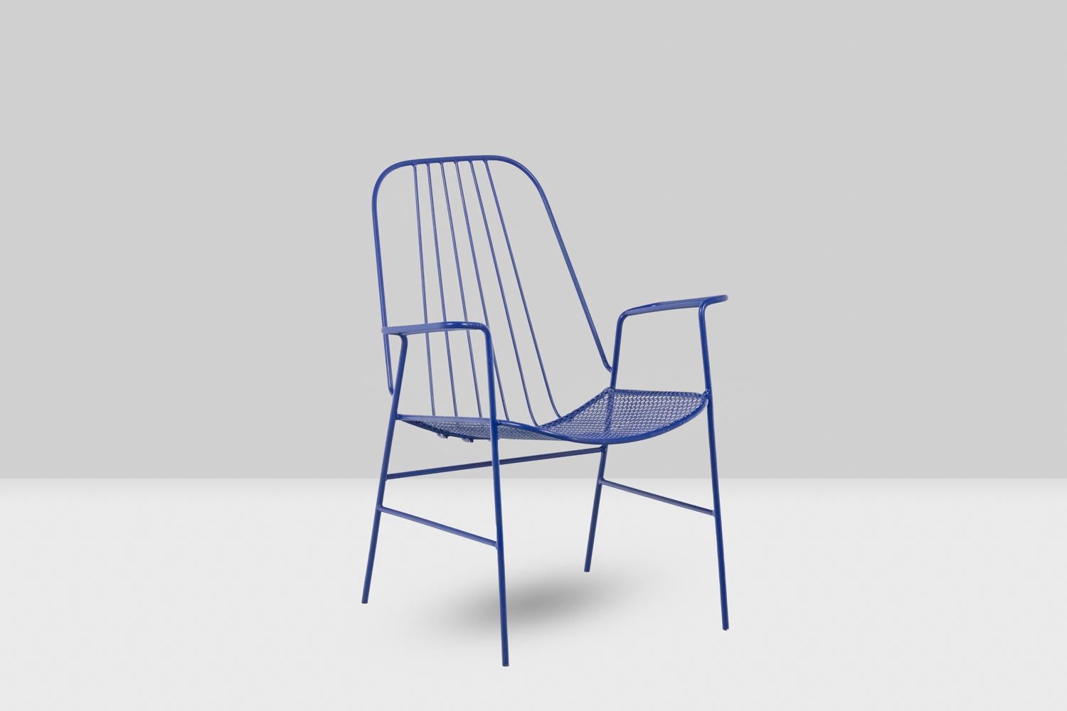 Mathieu Matégot, in the style of.

Pair of openwork iron armchairs, blue.

French work realized in the 1960s.