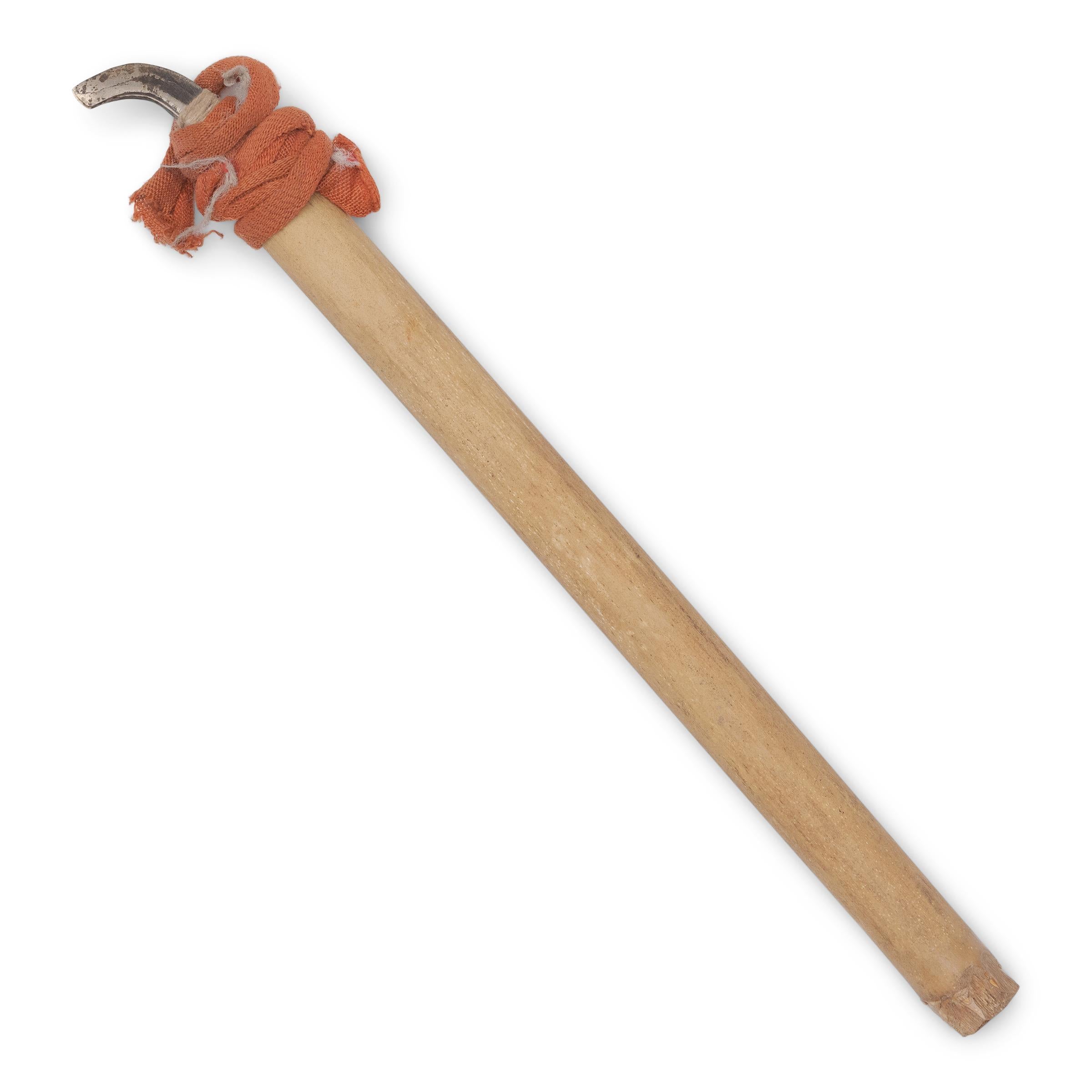 A pair of early 20th-century tools used for harvesting opium latex from poppy flowers. Formed of bamboo handles and iron blades, the rustic tools were used to scratch the surface of an opium poppy seed pod and collect the exuded latex after many