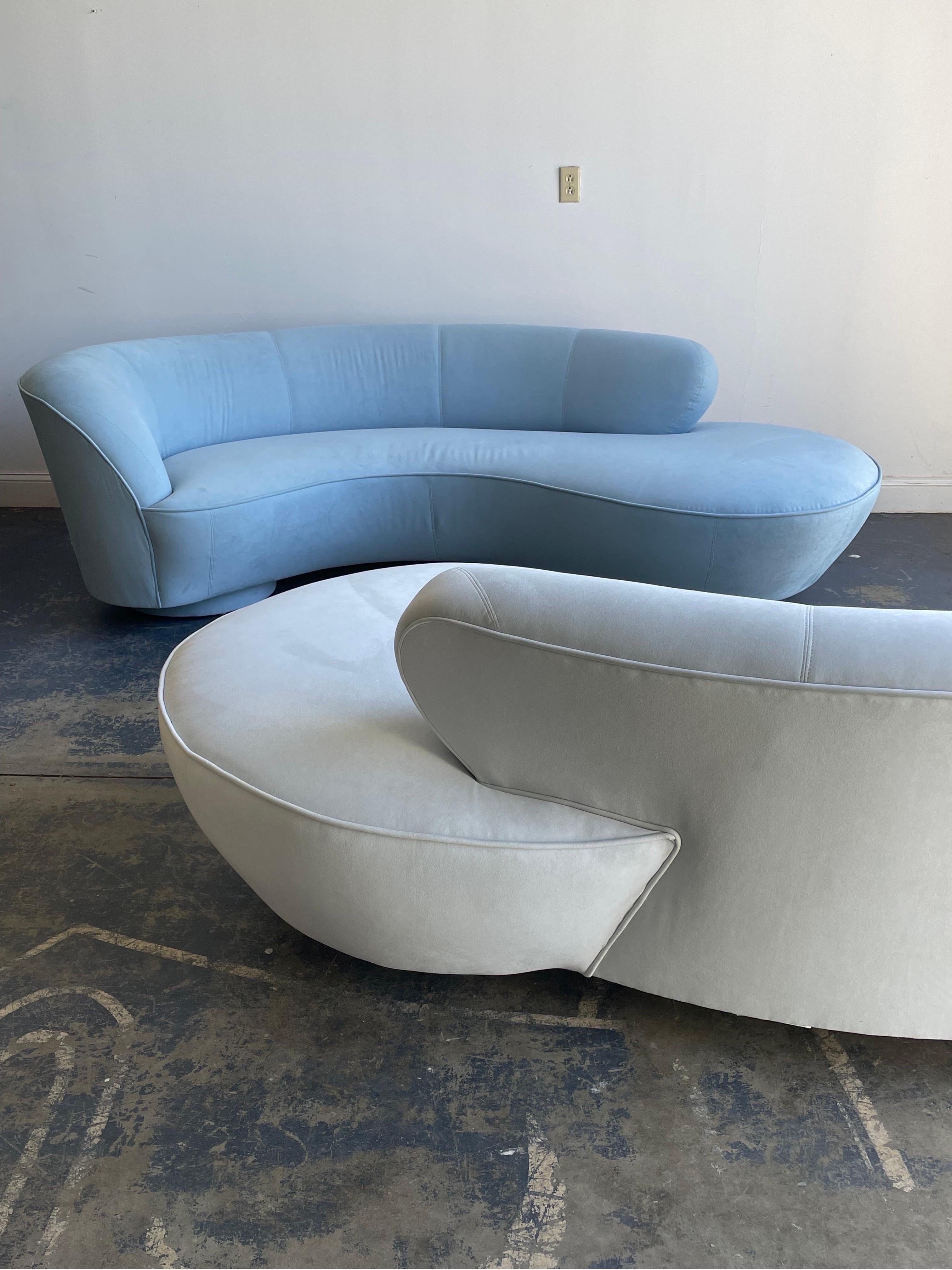 Pair of Opposing and Complimentary sofas designed by Vladimir Kagan for Directional. Sofas are in their original upholstery and were ordered together in complimenting colors. Please note the lighter one also has a slight blue hue. 

Vladimir Kagan