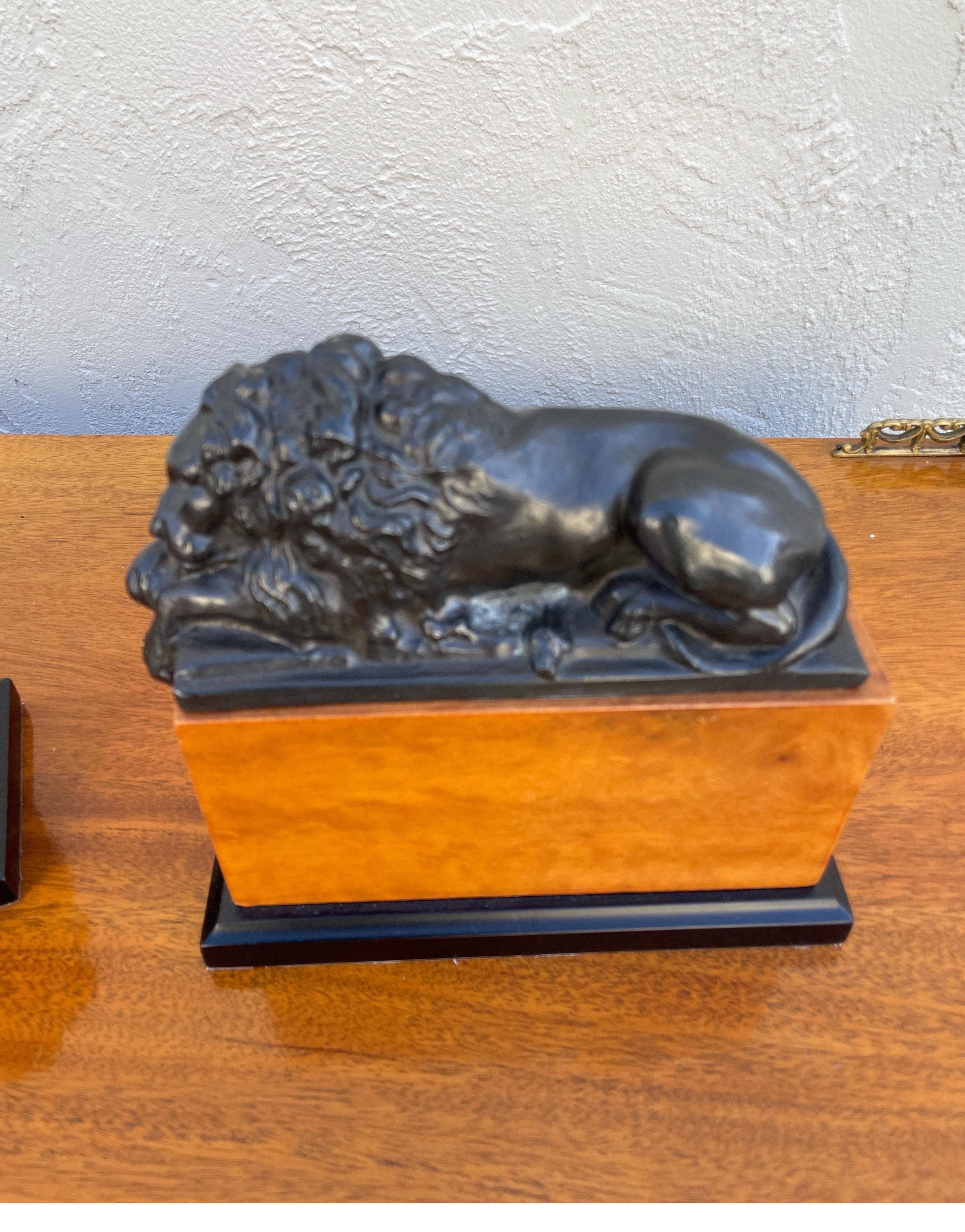 Vintage pair of opposing lion bookends in the Neoclassical style.