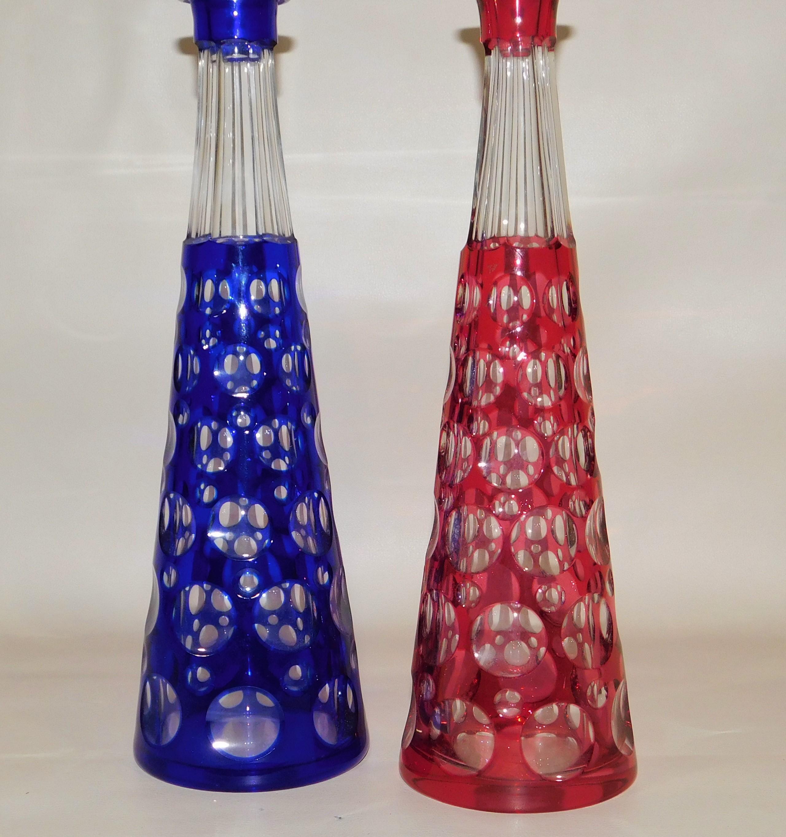 Beautiful vintage pair of red and blue Czechoslovakian/Bohemia optic cut handblown circles liquor decanters, circa 1950. With tops in excellent condition.