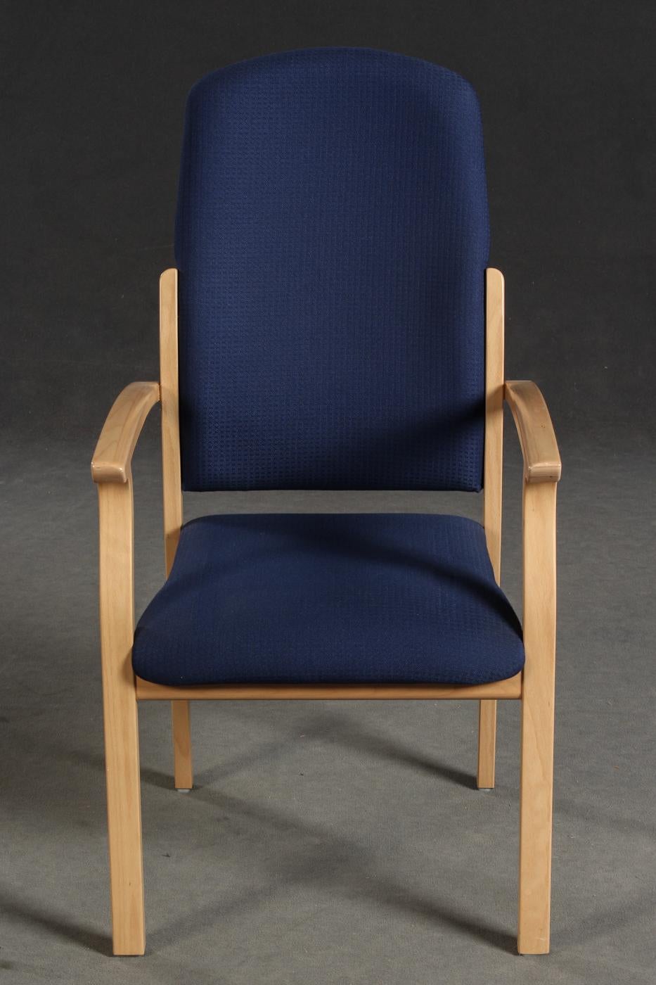 Pair of lounge chair by Brunner for Brunner Werk Design. Model: Opus. Frame of beech plywood. Seat and back upholstered with navy blue fabric cover.
