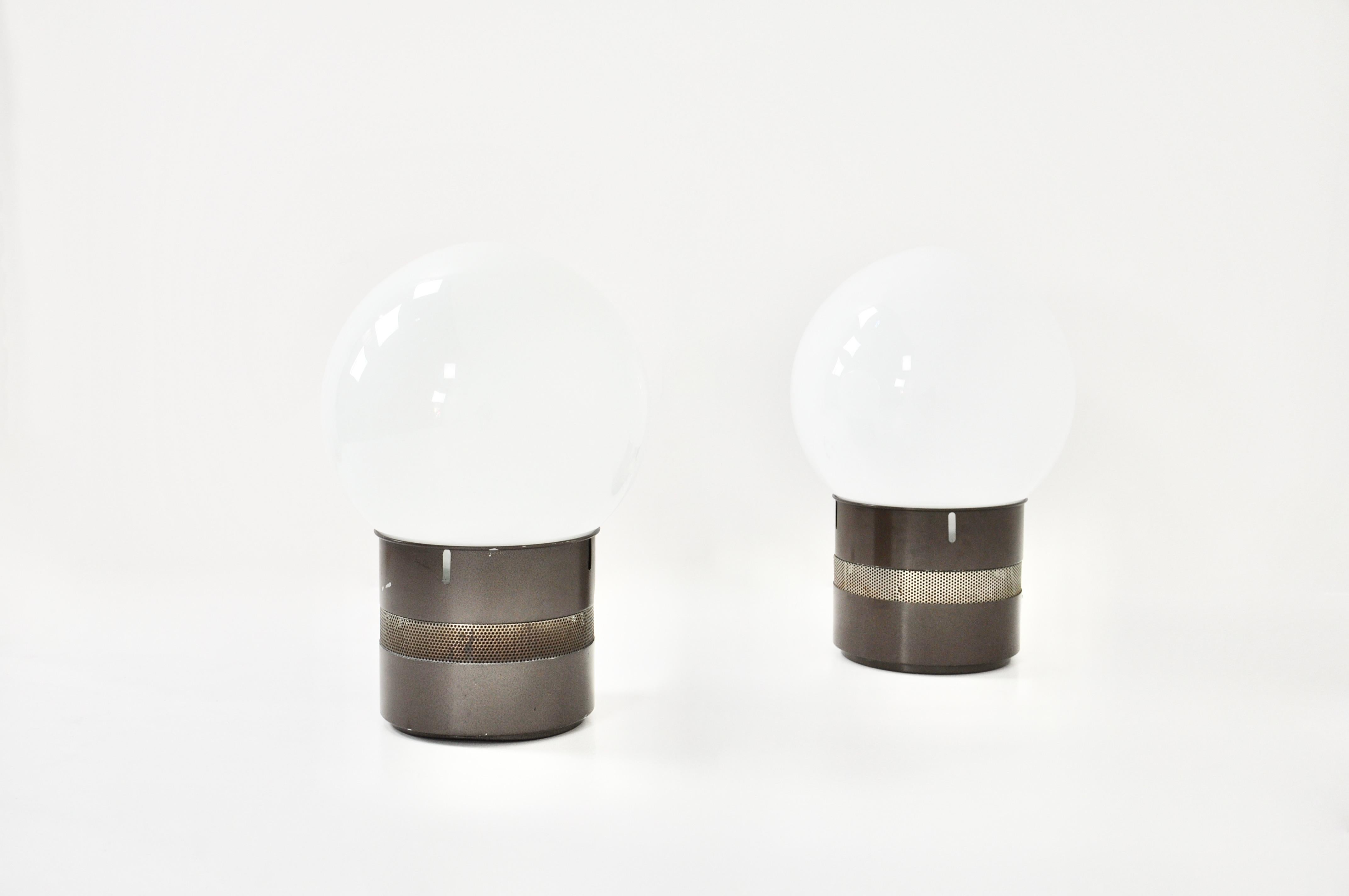 Paire de lampes en métal avec boule en verre Oracle par Gae Aulenti. Usure due au temps et à l'âge de la lampe.
Pour l'expédition, demandez-nous le meilleur prix.