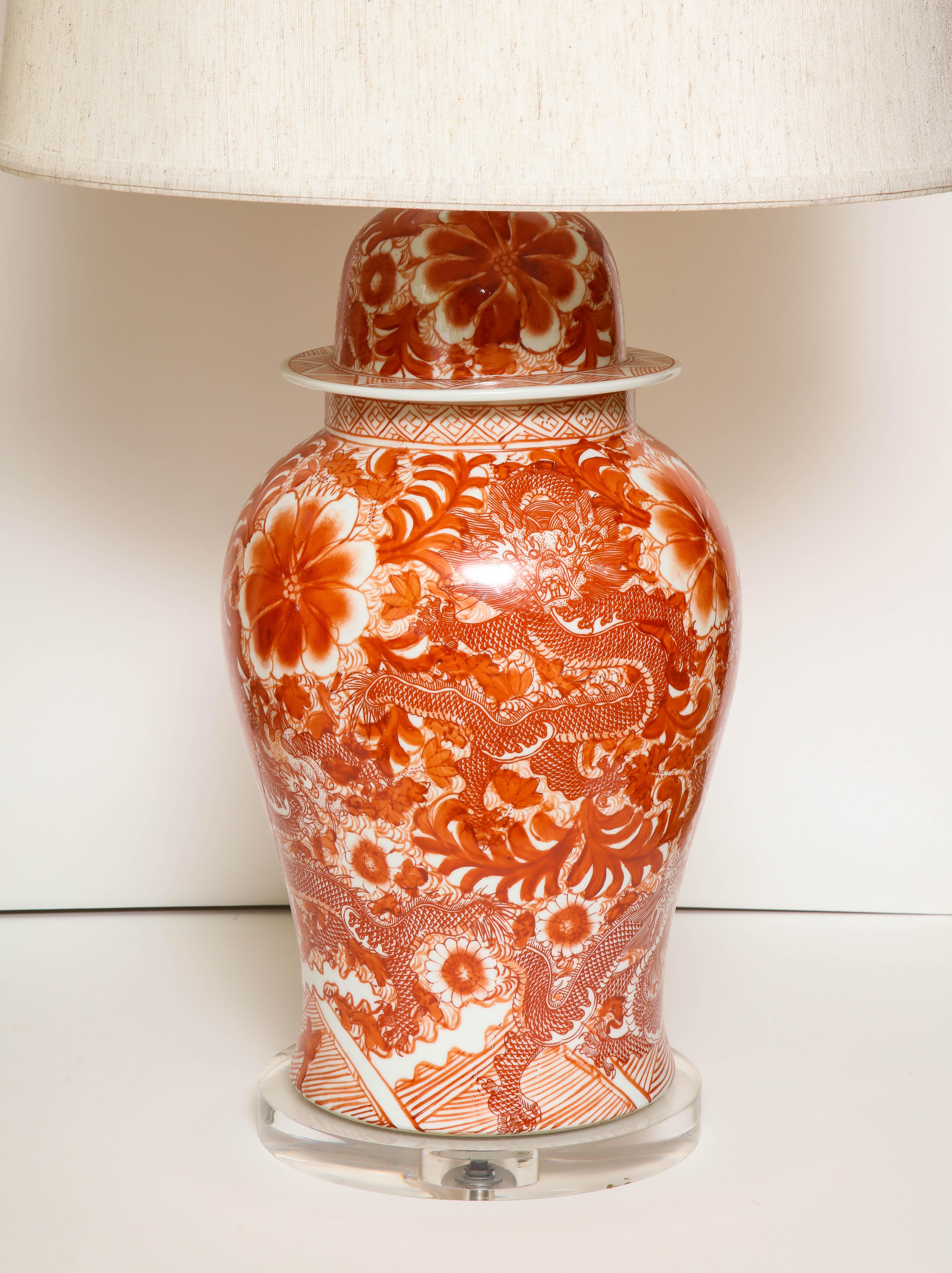 Chinese Pair of Orange and White Ceramic Lamps