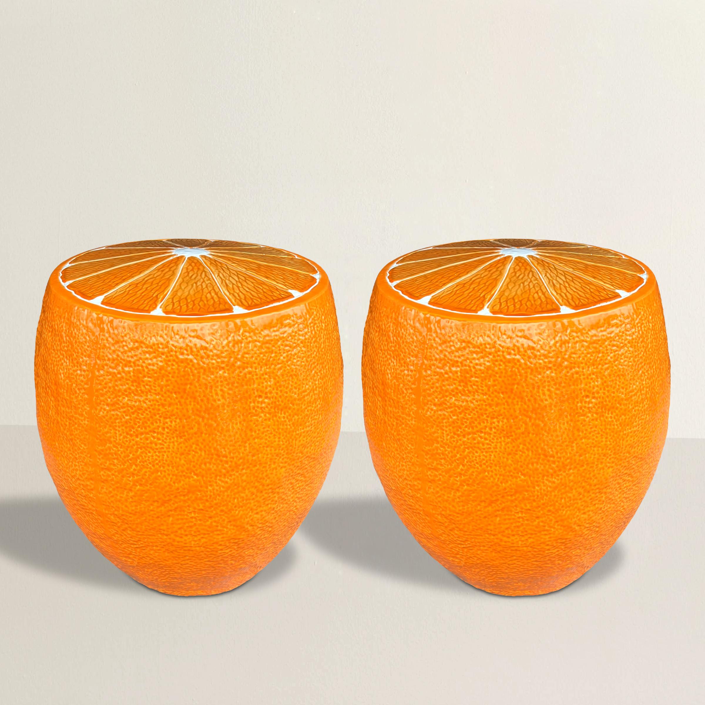 Infuse your space with vibrant charm using this delightful pair of glazed ceramic garden stools, each whimsically fashioned as an orange fruit. The exterior, textured like an orange peel, adds tactile interest, while the tops are artfully sliced