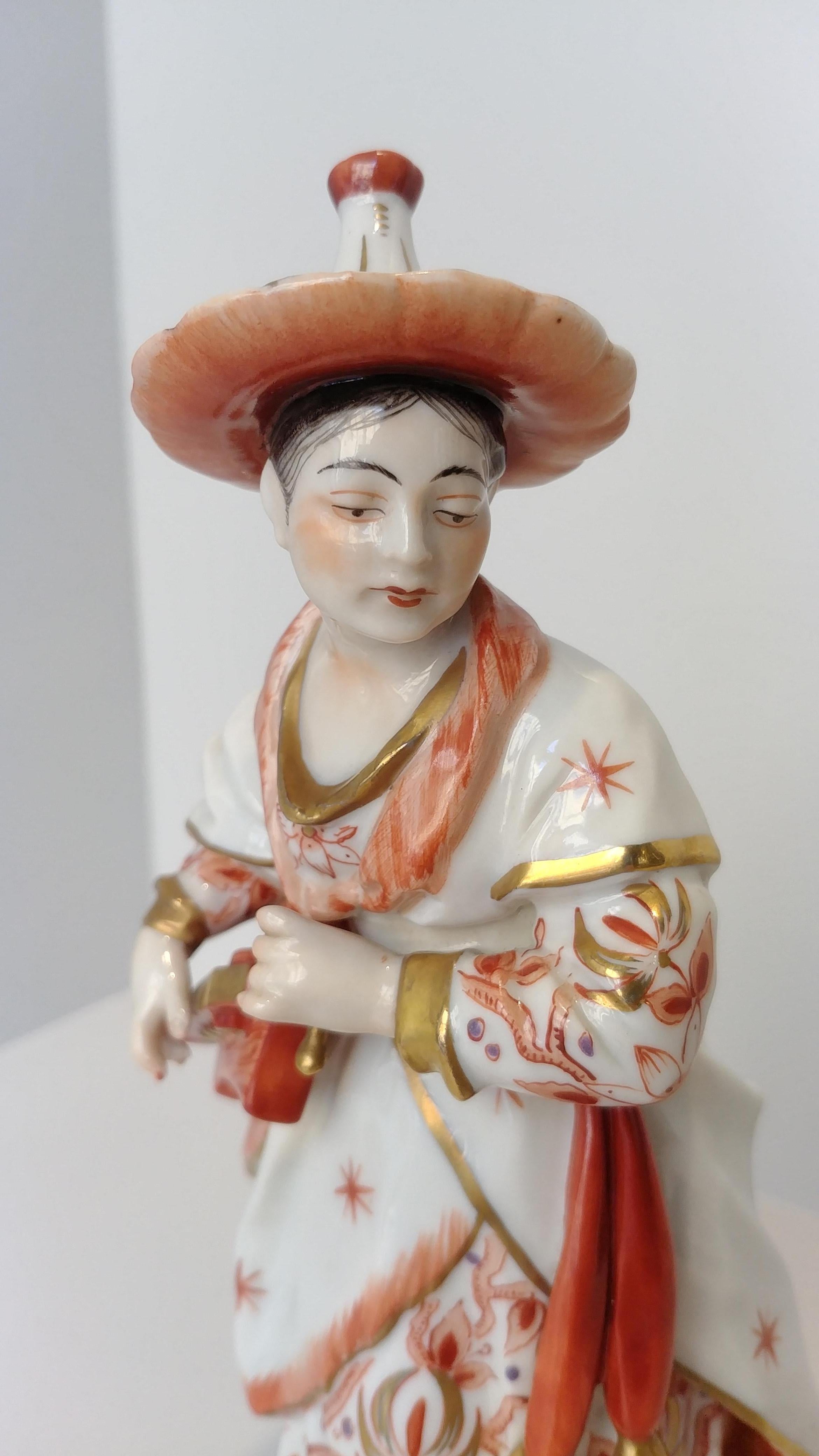 Hand-Crafted Pair of Orange Gold Dresden Porcelain Figurines Chinese Musicians, 20th Century For Sale