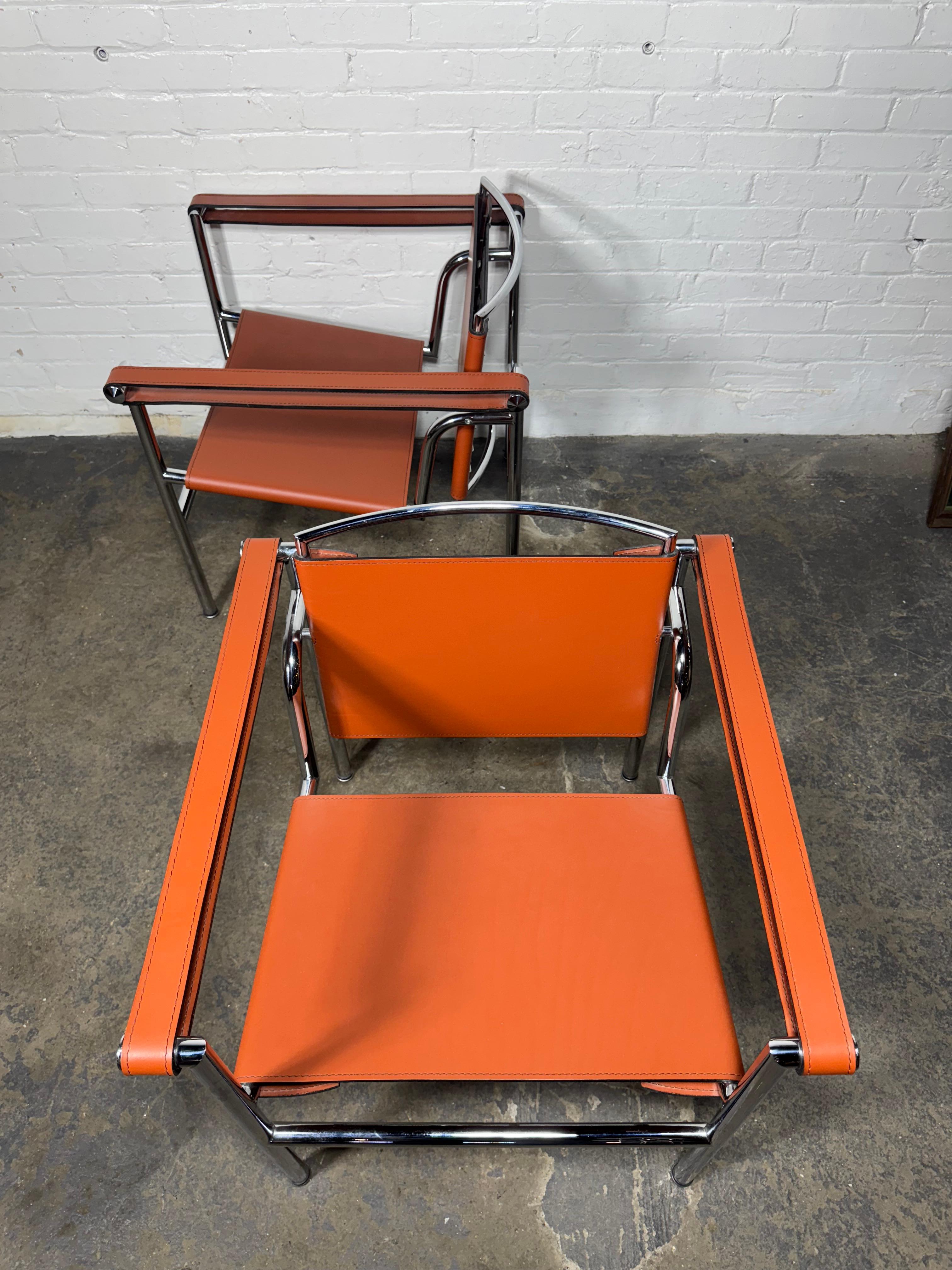 Unknown Pair of Orange/Pumpkin Leather Le Corbusier Armchairs LC1 / Design Within Reach