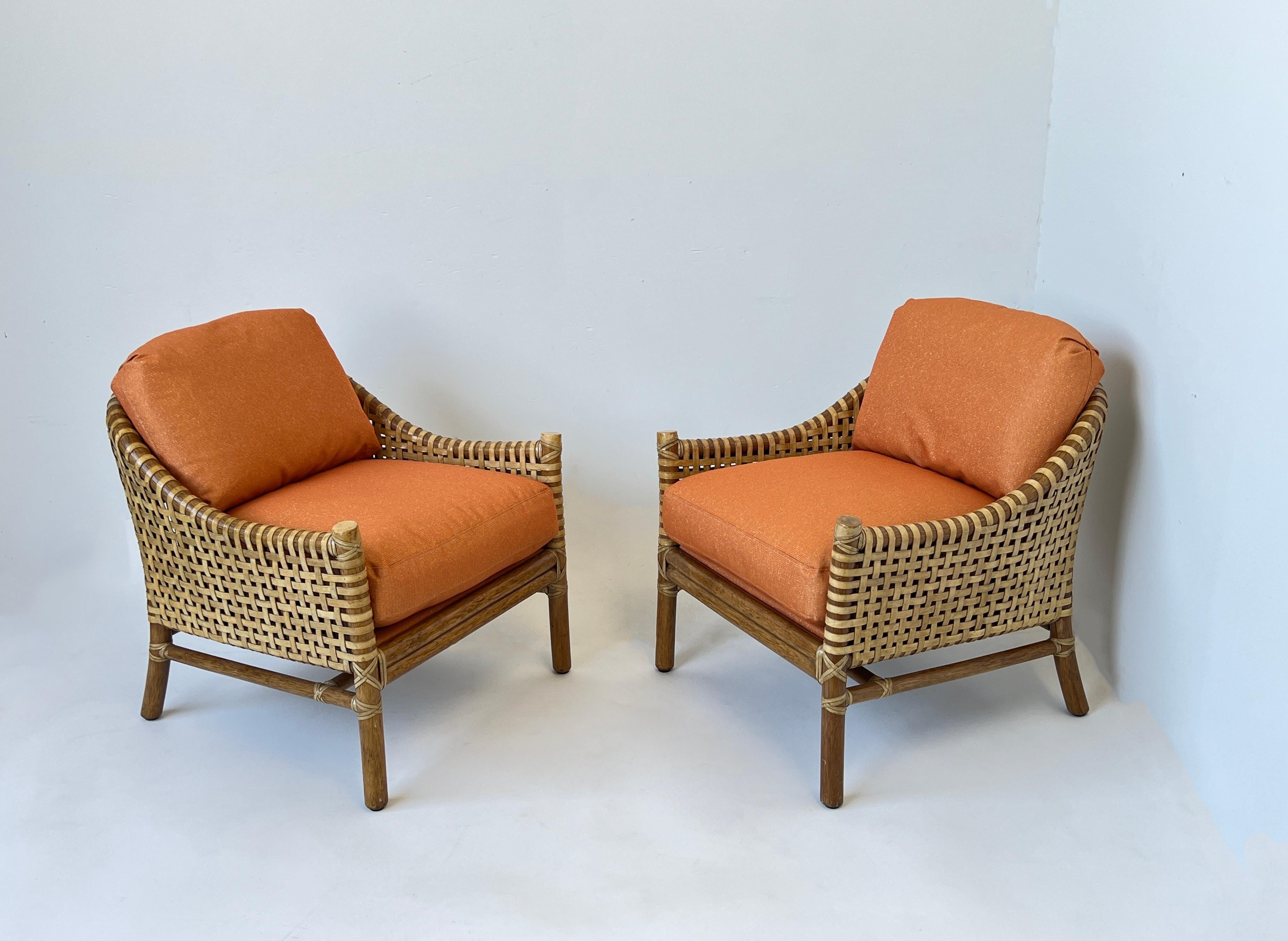 Fabulous pair of bamboo and woven rawhide Lounge chairs by McGuire.
The frames are in beautiful original condition, cushions have been newly recovered in a orange fabric with gold threads (see detail photos).
Measurements: 31” deep, 27.5” wide,