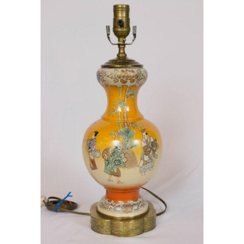 Orange Satsuma lamps with blue and green, with a traditional scene. Japan, Early 20th century. Completely restored and rewired. Rewired with new hardware. Original brass bases are polished with antique brass patina.

Dimensions: 
Width: