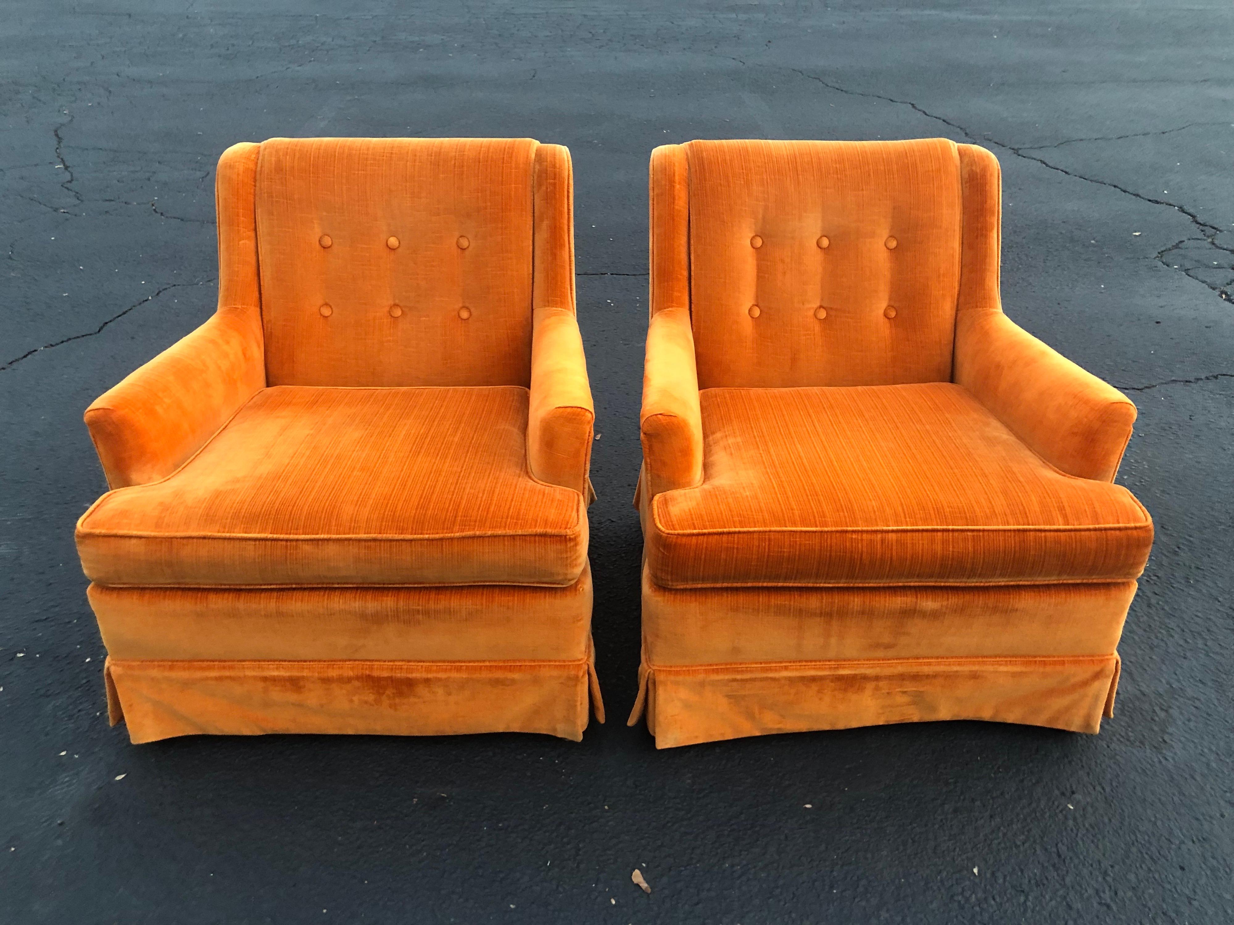 Pair of orange velvet chairs by Woodmark Originals. The company is based out of High Point North Carolina. These chairs must have been covered in plastic most of their life as there is little wear to the velvet for its age. Fun bright chairs that
