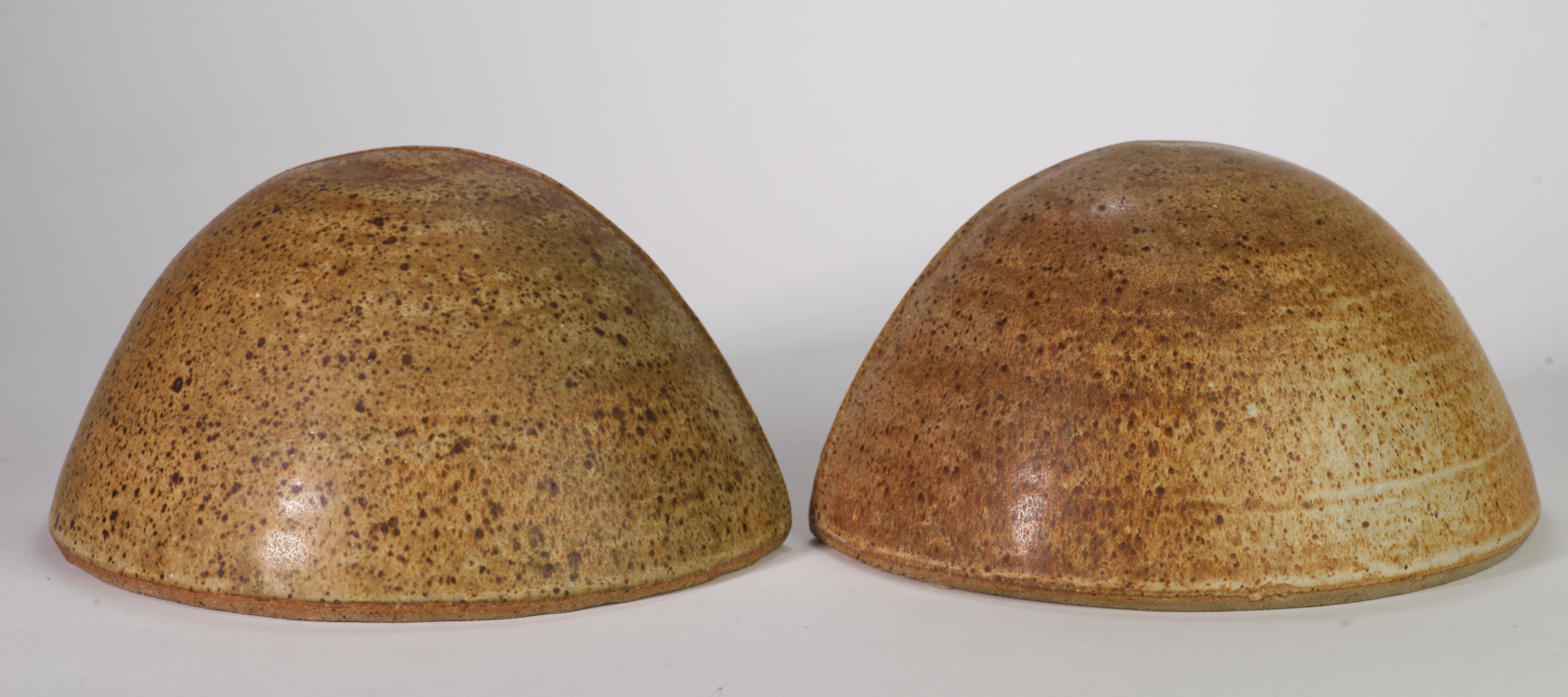  Vintage Organic Modern bookends were hand-formed in coil technique and hand-glazed in traditional salt glaze in earthy beige-brown palette. Minimally shaped pieces have cut openings on the inner sides for easy handling.

The pieces can be used