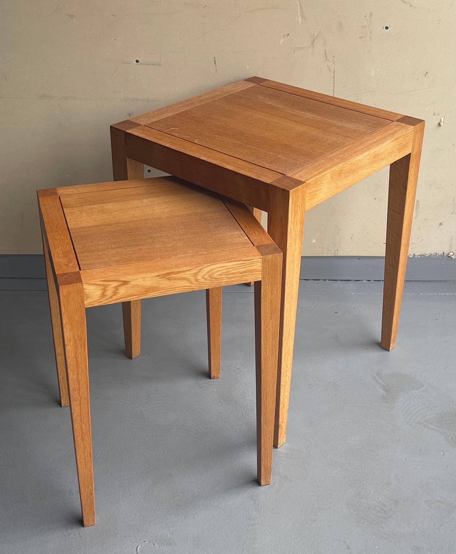 A very nice pair of square organic modern nesting tables by Gunther Lambert, circa 1980's. The tables are in very good vintage condition and I beleive are made of teak. The smaller one measures 15