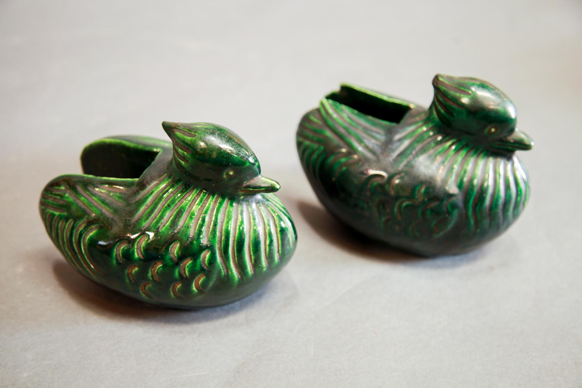 Pair of Oribe Mandarin Ducks screen holders, Japanese, Meiji period.

 Mandarin ducks shape, glazed ceramic with cutouts to allow ends of standing screens to securedly rest inside them. Oribe kiln is one of the oldest Japanese kilns and mostly
