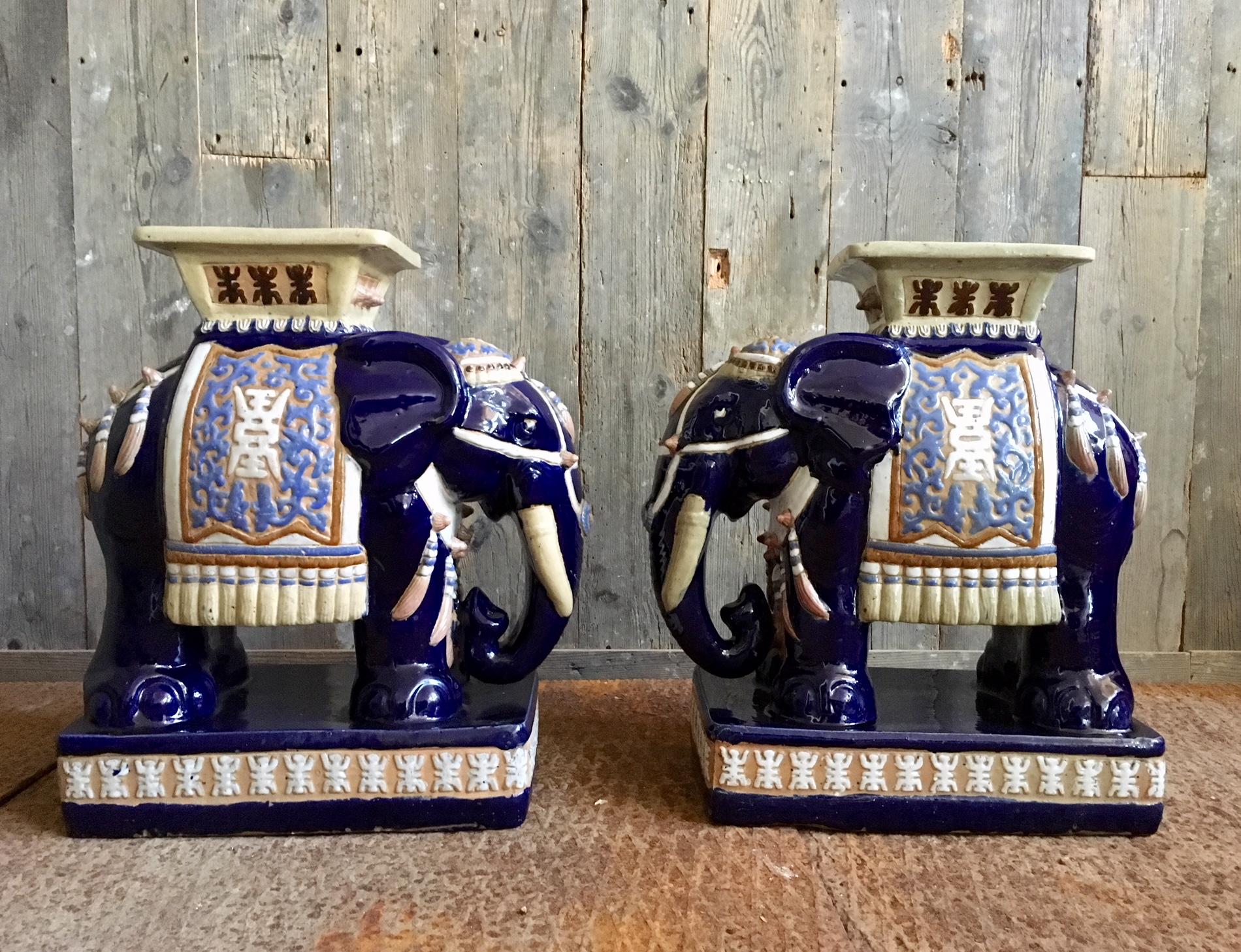Pair of ceramic oriental elephant stools or drinking tables from the 1970s. Very decorative and detailed. In Hollywood Regency style. Measures: 20 cm in depth, 53 cm in height and 47 cm in width.
