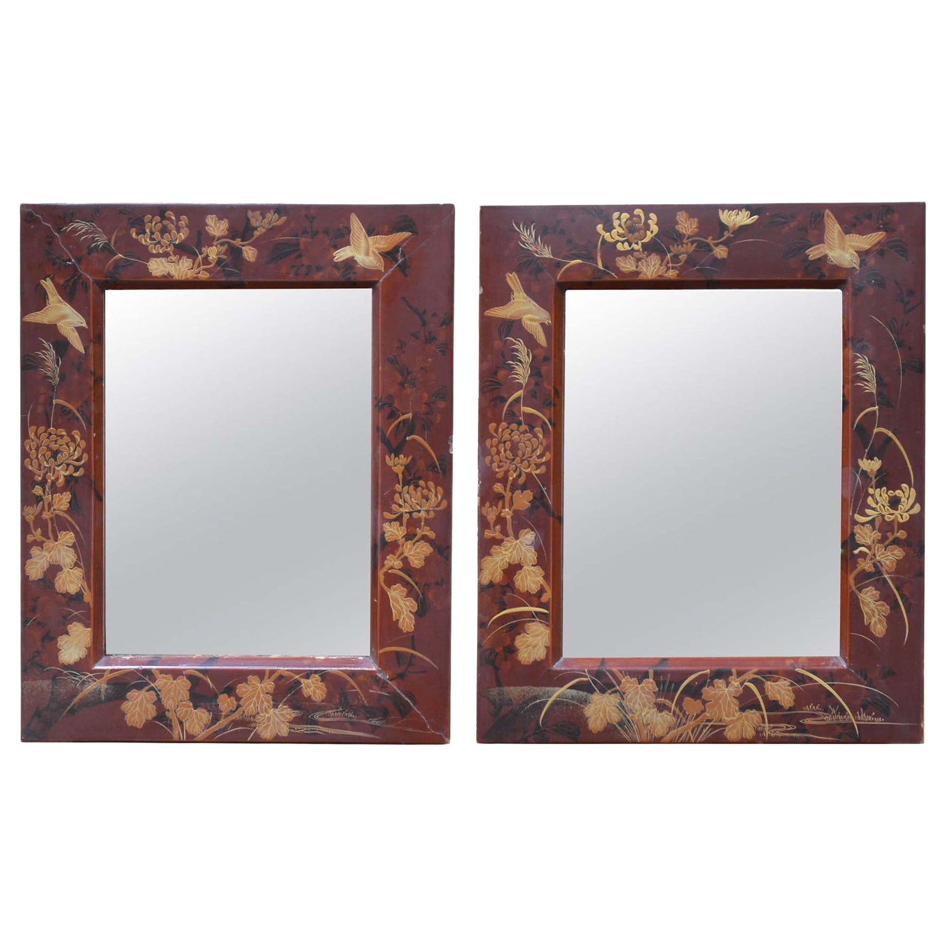 Pair of Oriental red lacquer mirrors