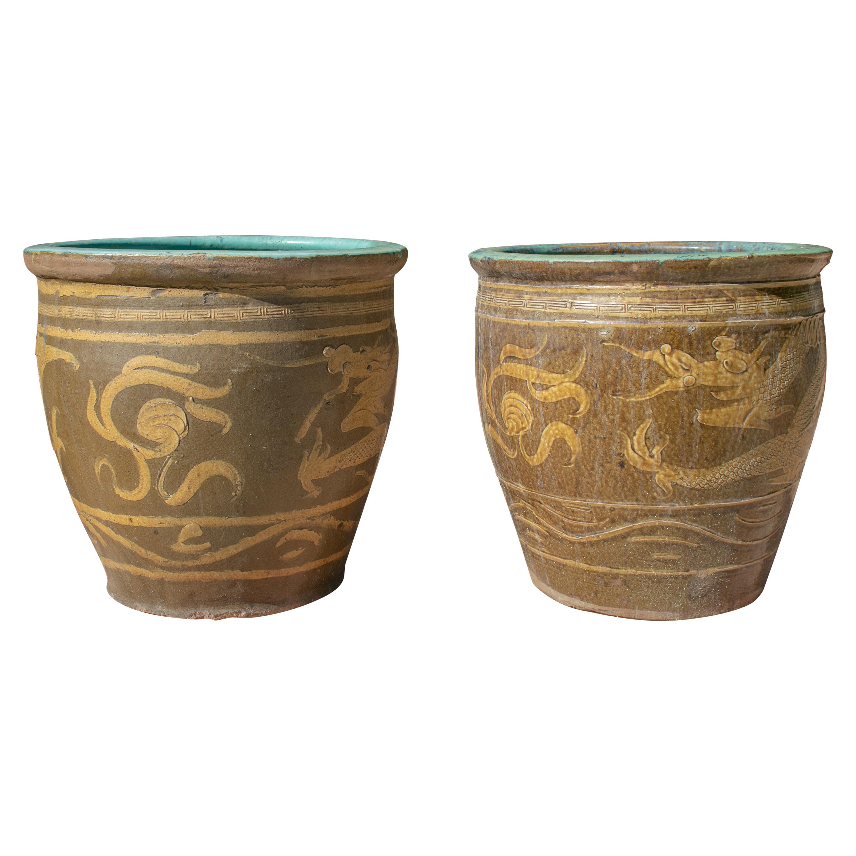 Pair of Oriental Style Ochre Colored Pots with Dragon Decoration at