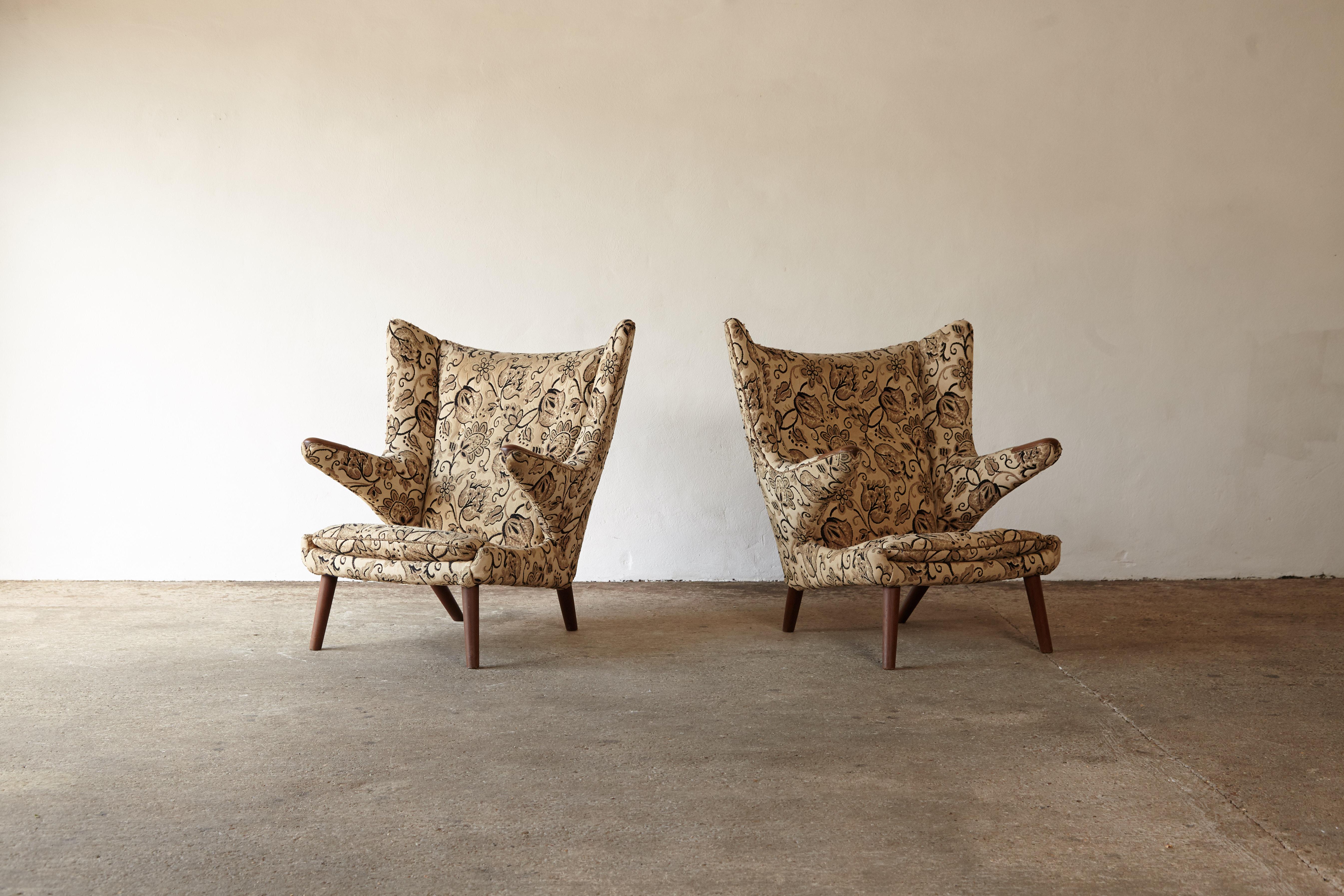 An original pair of Hans Wegner papa bear chairs designed in 1947 and produced by AP Stolen in Denmark in the 1950s. The price in this listing includes expert re-upholstery in customer supplied material. The chairs require re-upholstery but