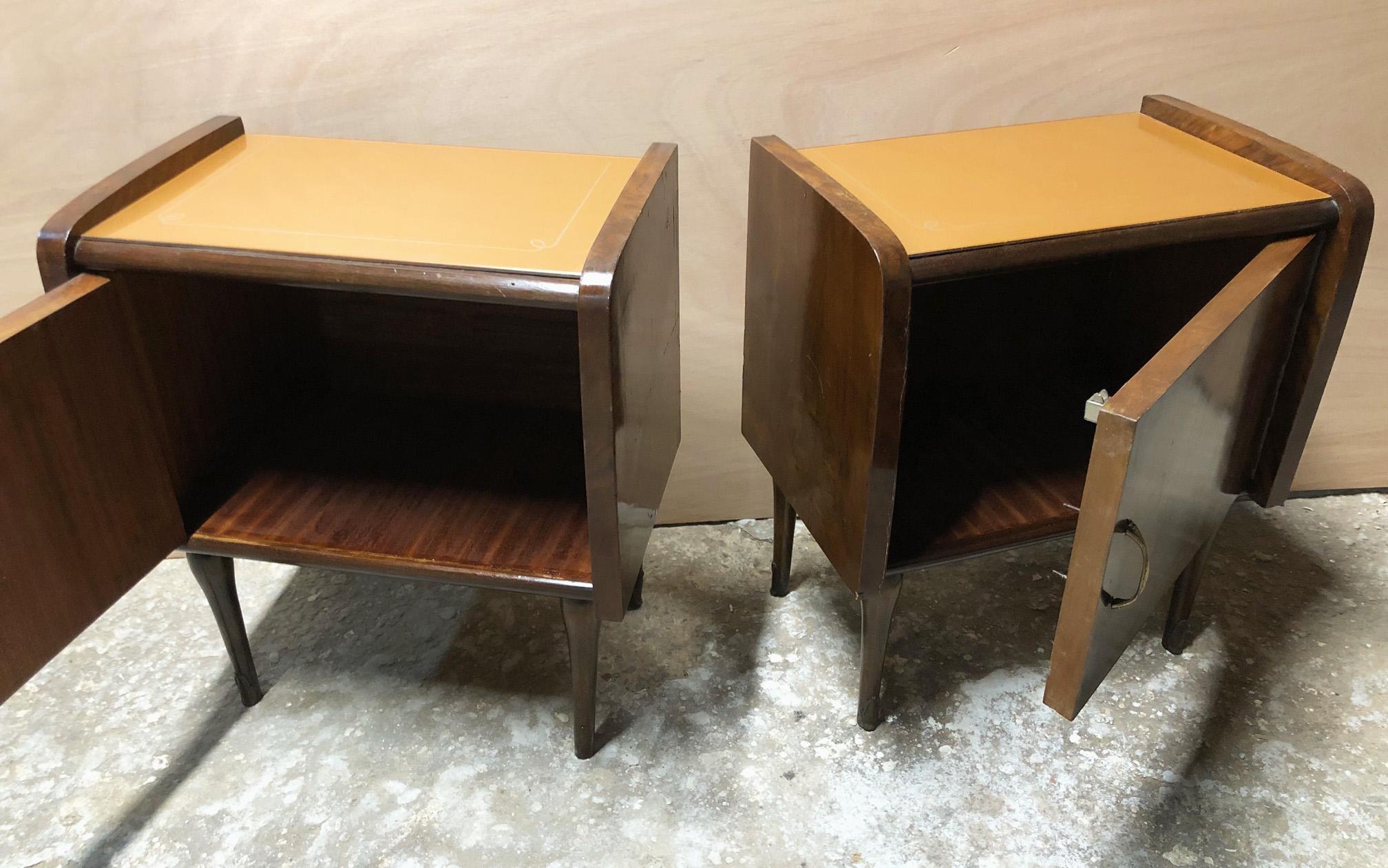 Pair of original 1960s Italian nightstands with salmon-colored glass top. 
Walnut wood.
One is Right and one is  left.
They will be delivered in a specific wooden case for export, packed in bubble wrap.
Comes from an old country house in the Pisa