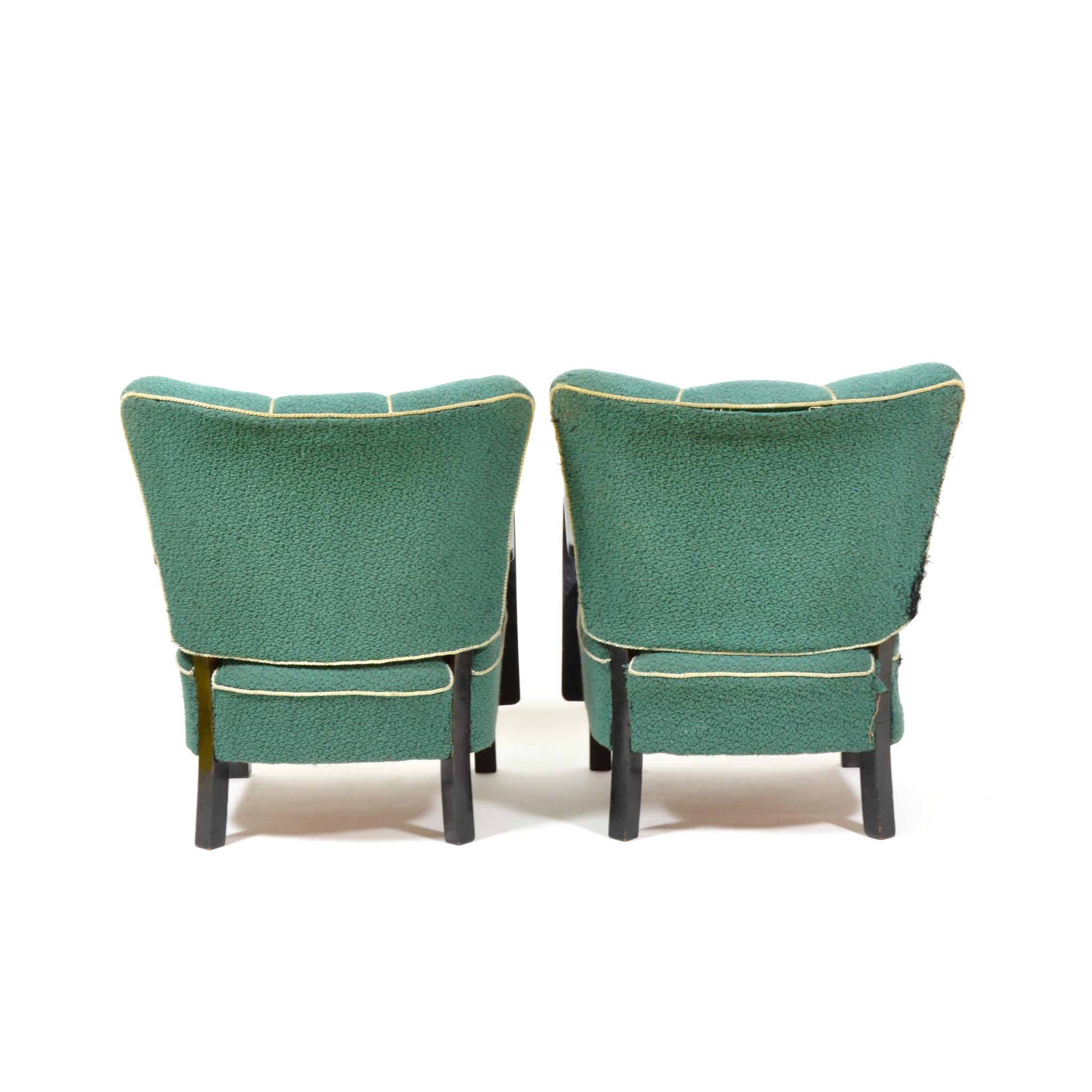 Pair of original armchairs with markedly shaped backrest in art deco style. Armchairs are in original condition, need to be refurbished. Spring seats with original padding. Manufactured in former Czechoslovakia during 1940s.