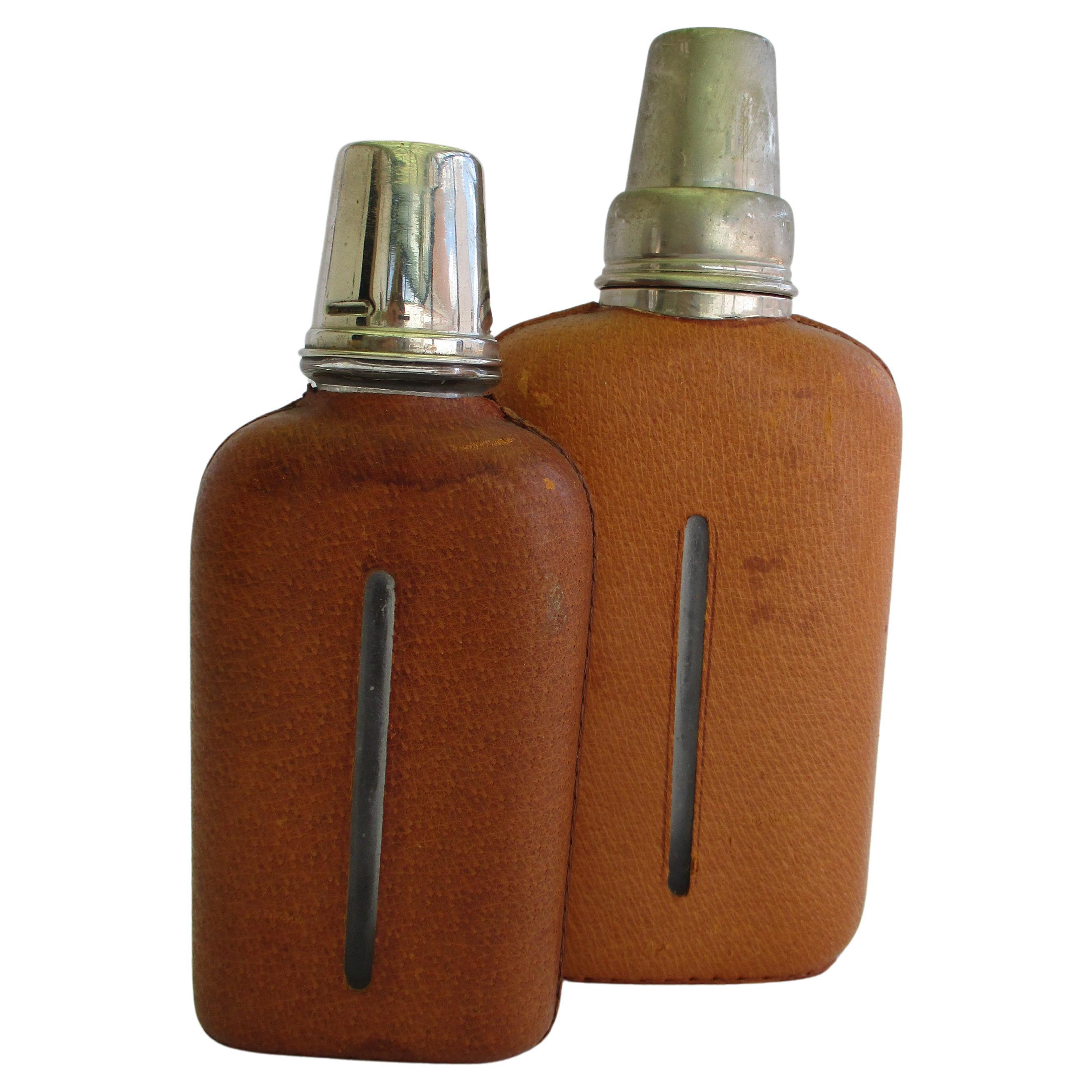 Pair of original Aubock leather wraped Hip Flasks