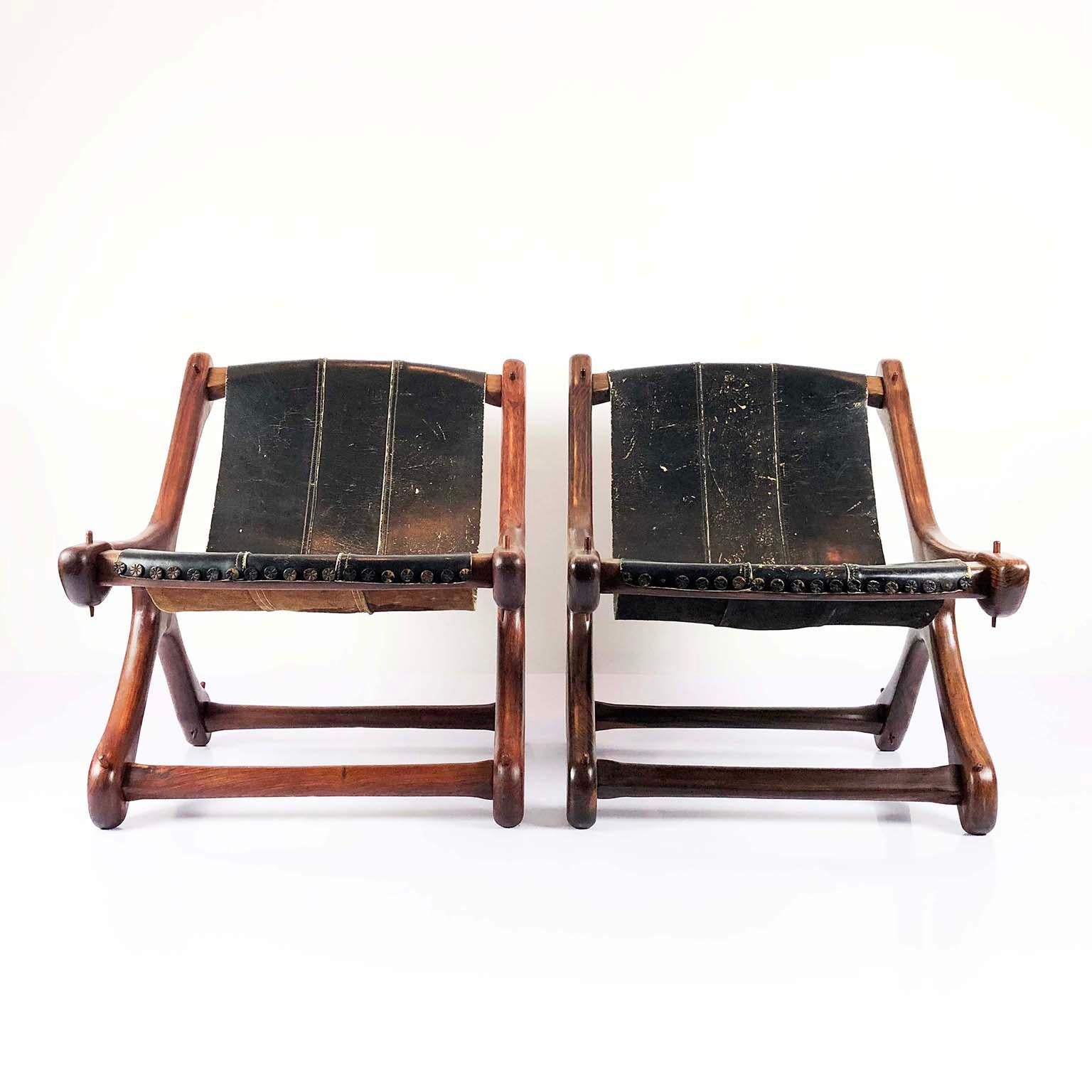 Pair of original vintage sling chairs designed and produced by Don Shoemaker for Señal S.A, solid Cocobolo with original black leather sling seat, circa 1960.