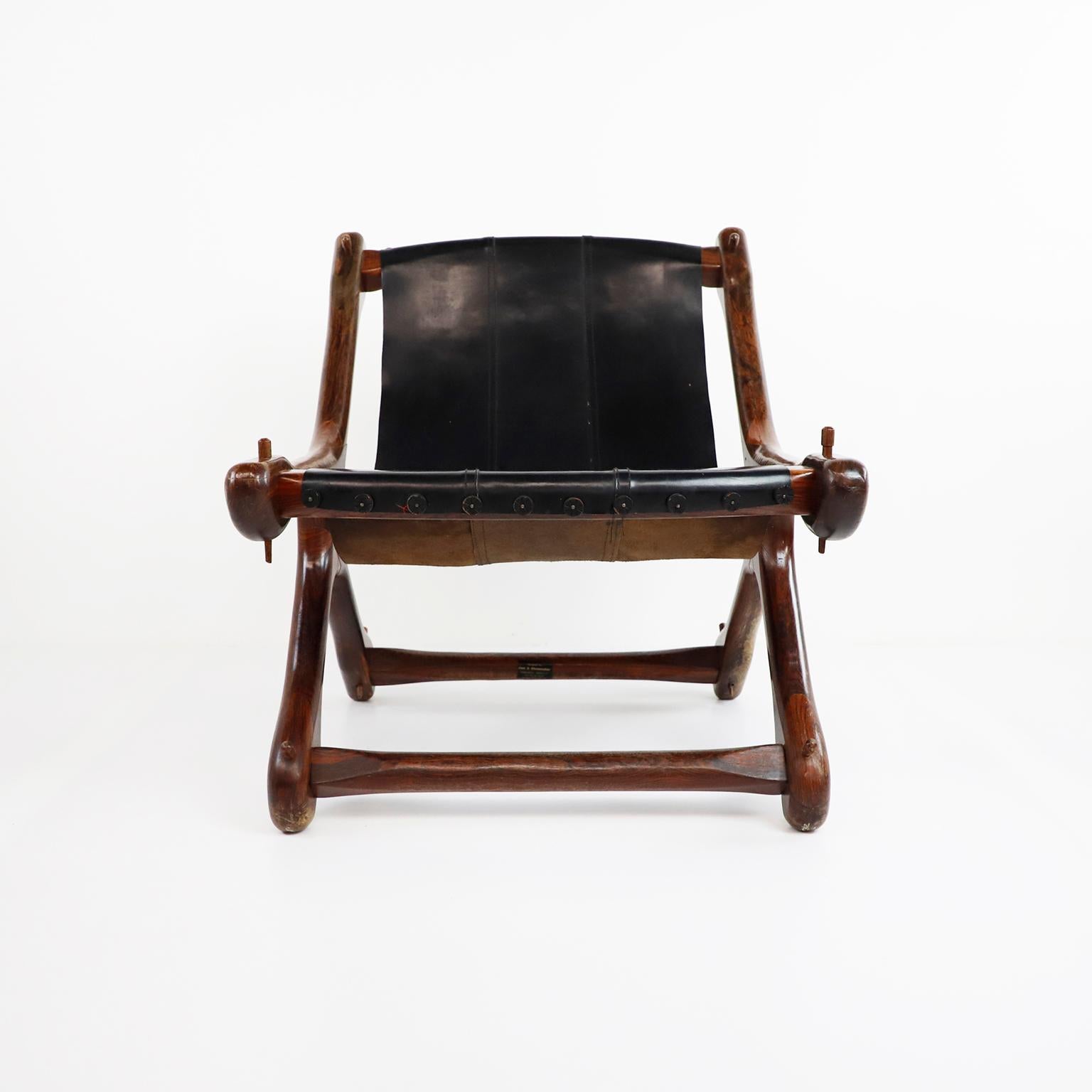Pair of original vintage sling chairs designed and produced by Don Shoemaker for Señal S.A, solid Cocobolo with original black leather sling seat, circa 1960, includes original label, great vintage conditions.