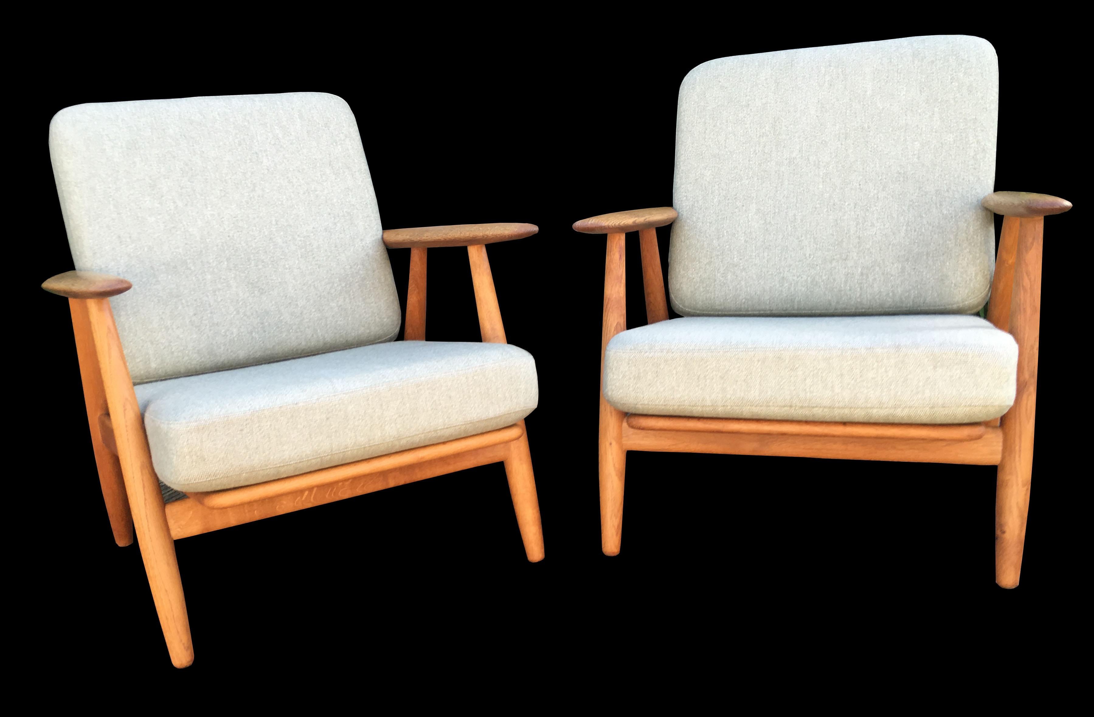 A very nice early original chairs by Hans Wegner for GETAMA in very good condition, a nice patina on the frames. Legs and arms, and with fresh new cushion covers in mint green wool.