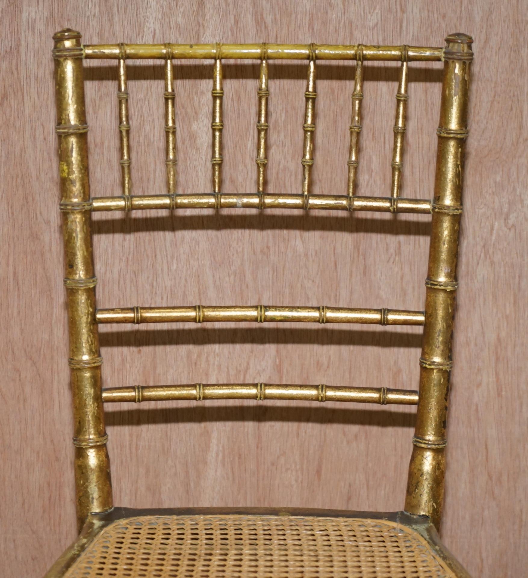 Hand-Crafted Pair of Original Giltwood Famboo Regency Bergere Chairs with Period Gold Gilding For Sale