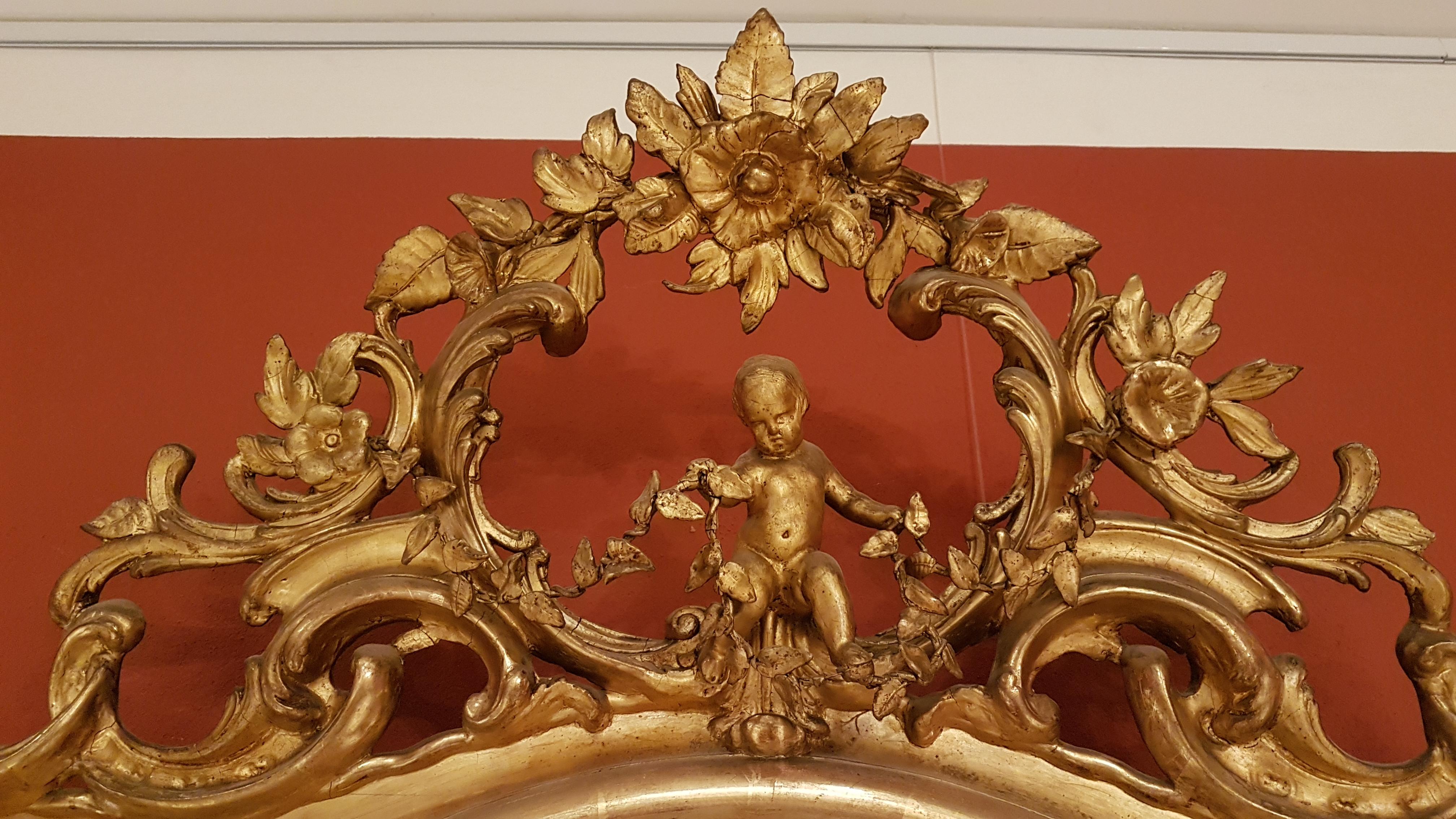 Italian Mirrors Pair of authentic Louis XV style in pure gold with rich carving 1830s For Sale