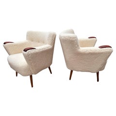 Pair of original loungers in sheepskin by danish cabinet maker - 1950s.