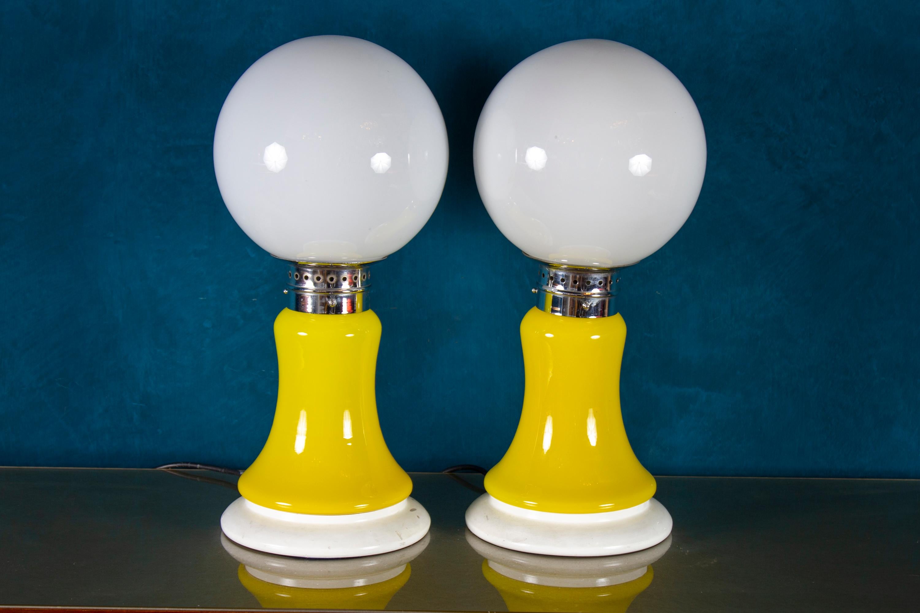 Amazing Mazzega pair of table lamps. Made of yellow glass and chrome-plated metal.
 Perfect vintage condition.