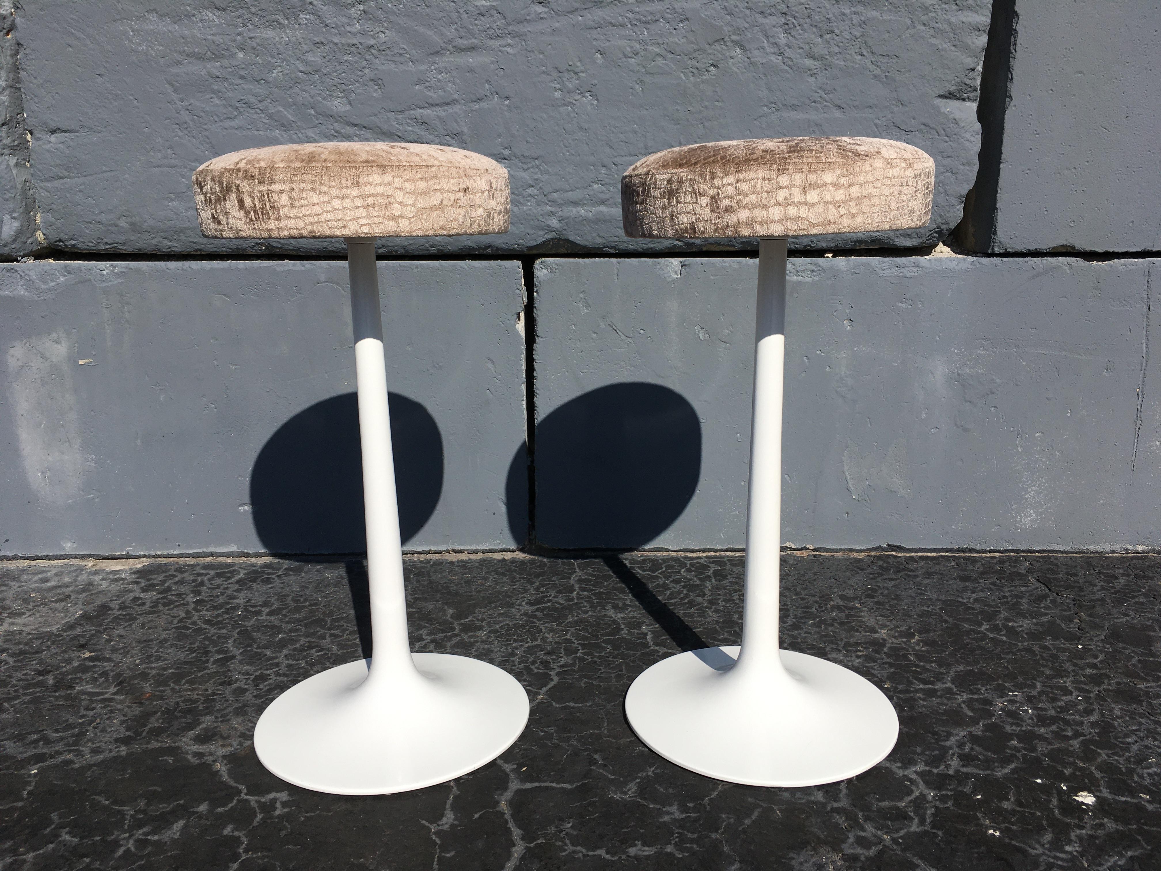 Pair of original midcentury swivel tulip bar stools in the style of Eero Saarinen. Fabric seats.