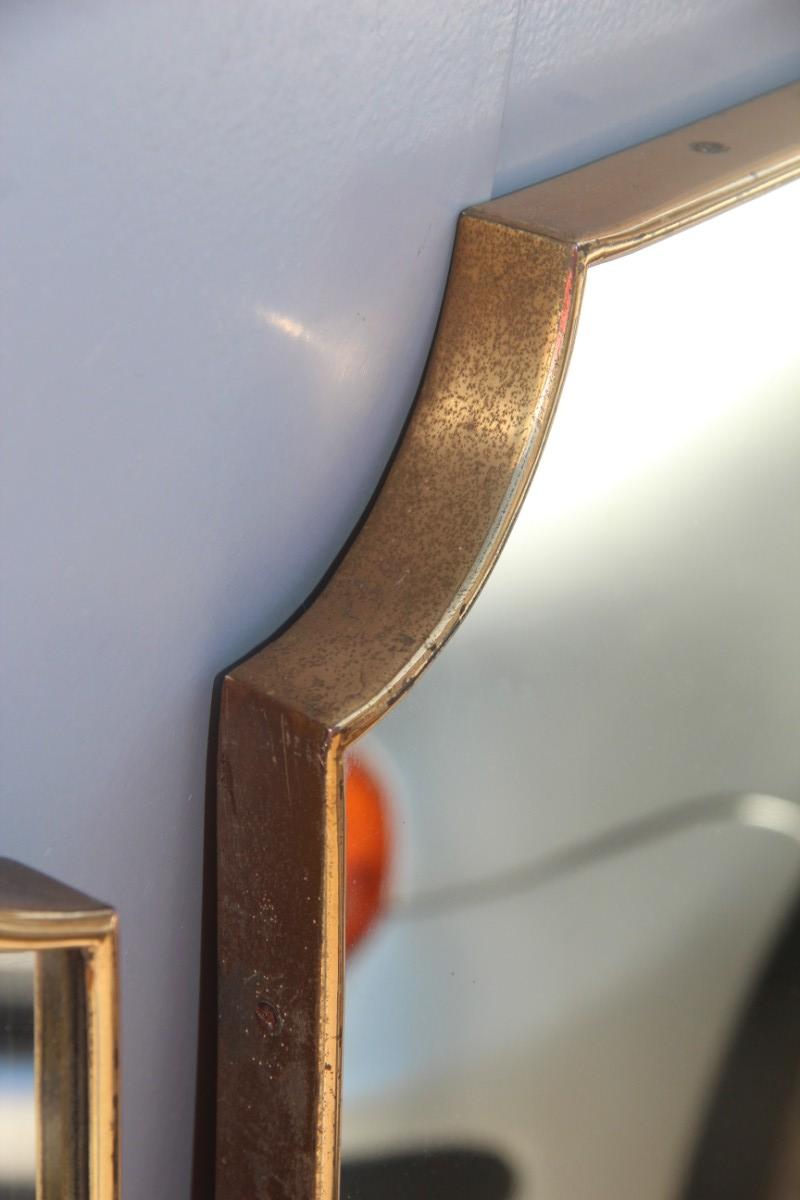 Pair of original old Italian midcentury wall mirror, original 1950s, side frame in shaped brass, original mirror.