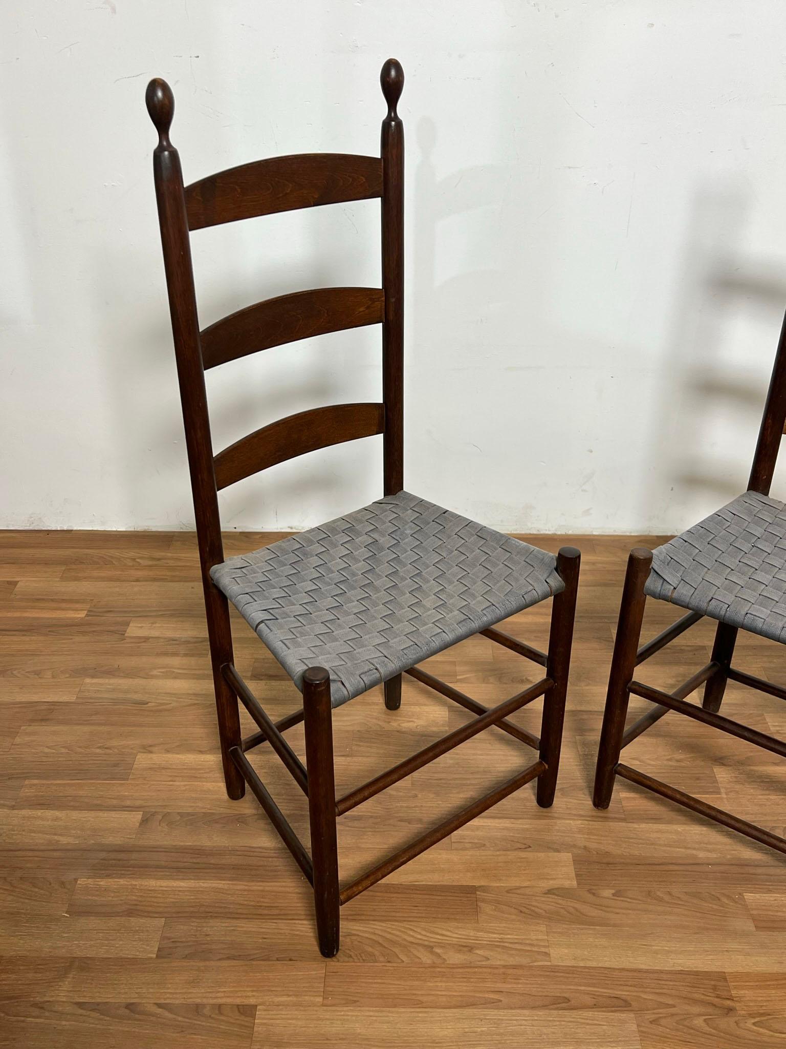 An original matched pair of Shaker high back chairs from the Enfield, Connecticut Community of Believers, circa. 1840-1860s.