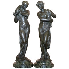 Paire de statues originales en bronze signées Henri Dumaige 1830-1888 représentant des porteurs d'eau